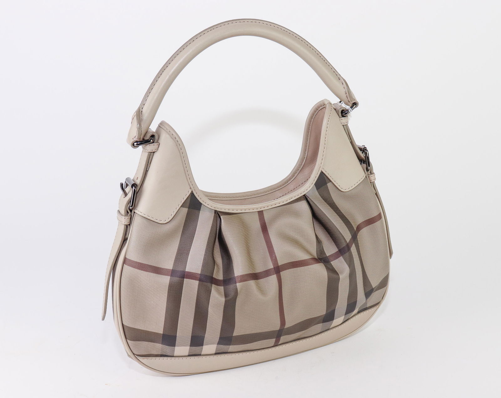 Burberry Brooklyn Hobo in Beige Smocked Check Canvas: Genuine Pre-Owned Burberry Brooklyn Hobo in Beige Smocked Check Coated Canvas in AA condition. Date Code is CNDONHOUDON . Measurement: . This lot includes a certificate of authenticity.