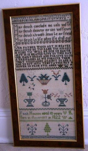 Framed British Sampler Created in 1832: William IV British antique sampler in modern frame; Frame measures 20.1 x 10.5 x .5 in.; The sampler image size is 18 3/4 x 8 in.; This sampler was created by Faith Howson, born in Attercliffe in 1822