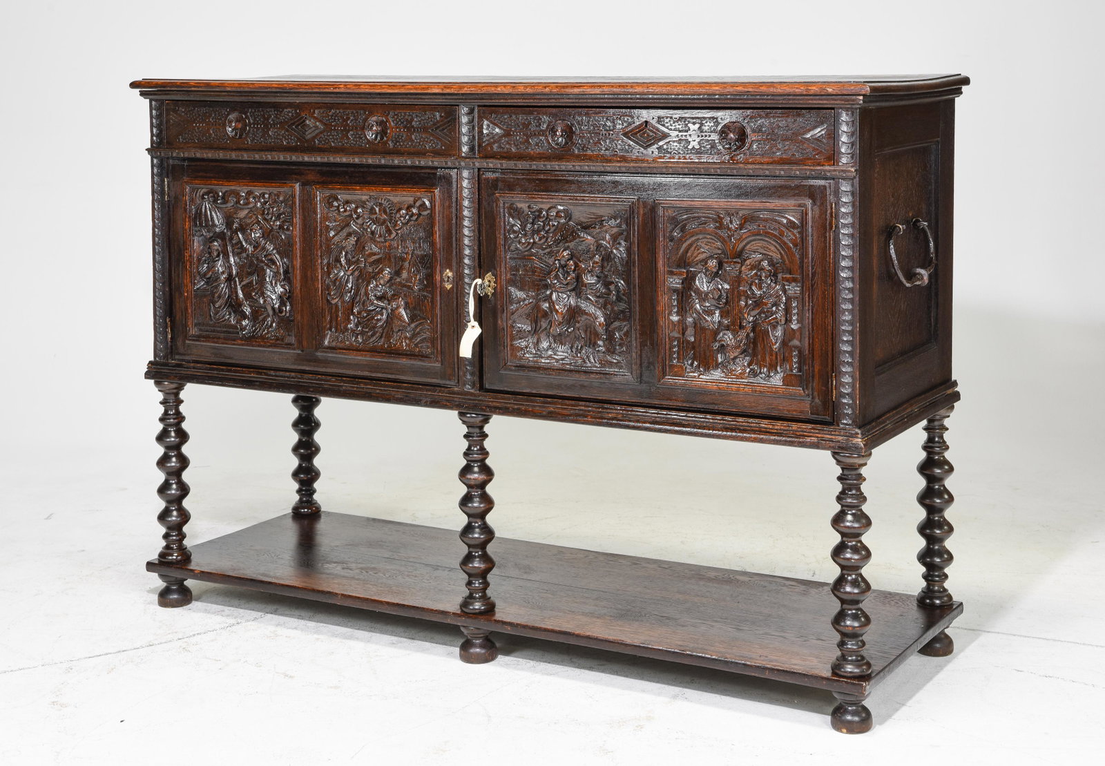 Heavily Carved Oak Buffet with Pot Rack Base: Heavily Carved Oak Buffet with Pot Rack Base and Figural Relief - 47 in tall x 69 x 23