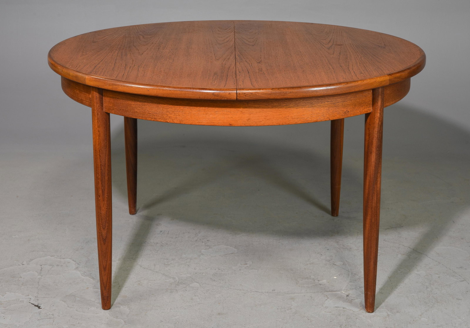 Round Mid Century Table By G-Plan - Pop Up Leaf: This Danish Modern Style Teak Dining Table includes a pop-out butterfly style leaf & is made by Mid Century Modern Furniture Maker G Plan ( Gplan ) - Part of their Fresco Range. - 30 in tall x 48 inch