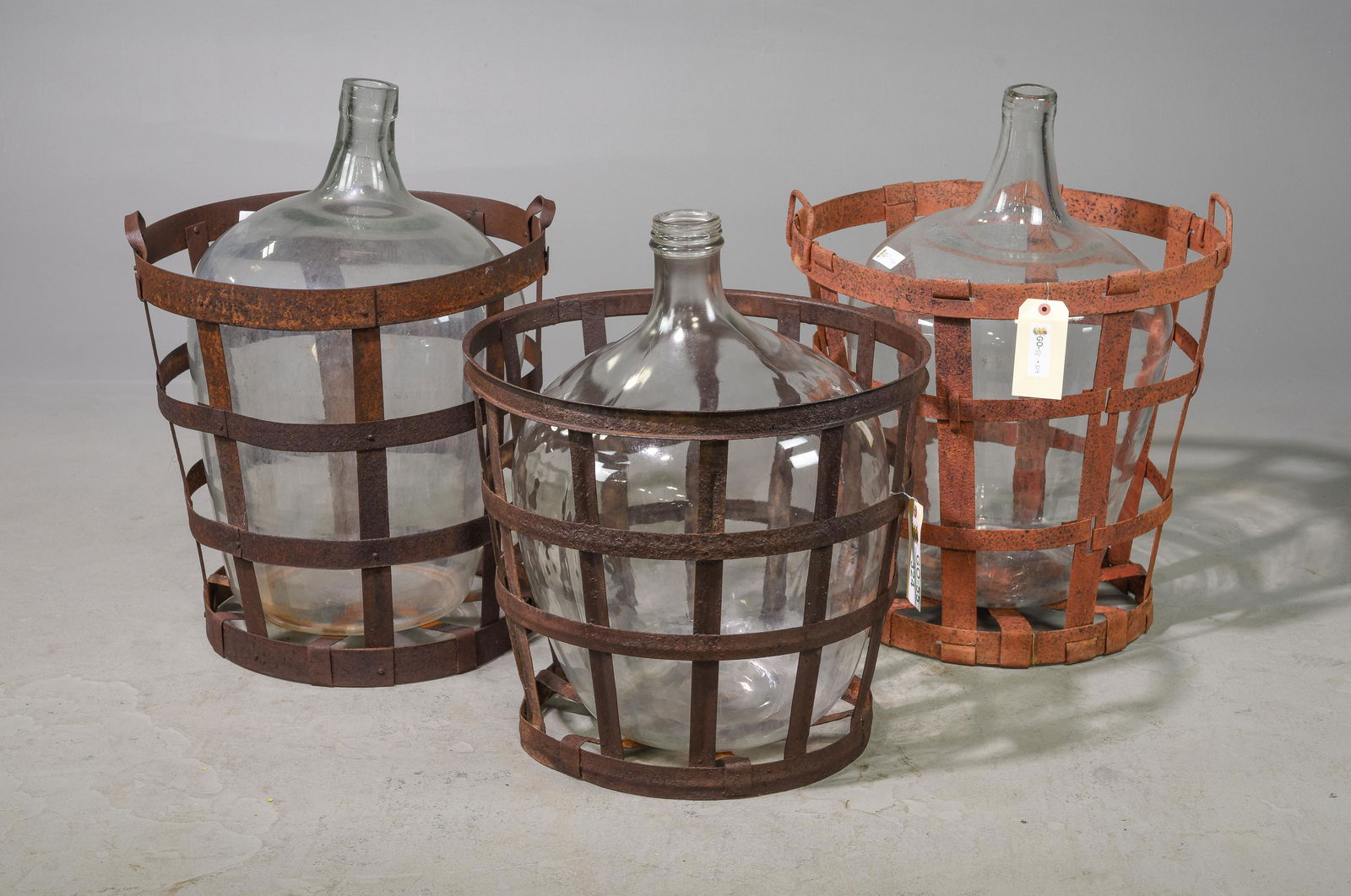 3 Large Glass Demijohns in Metal Baskets (1 of 2)