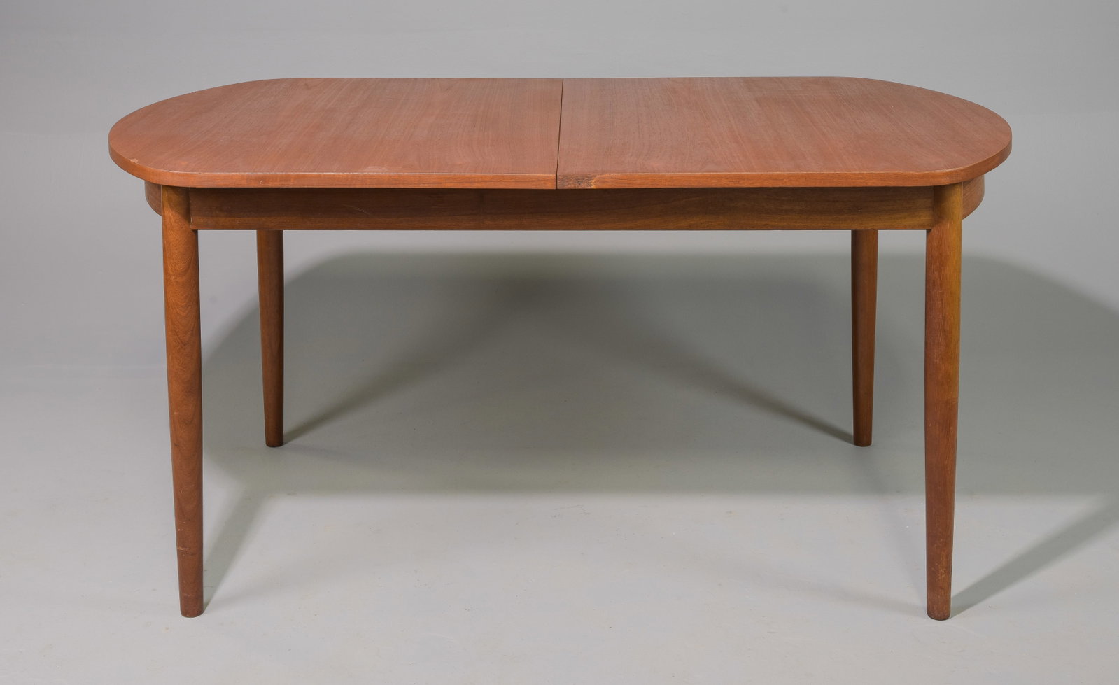 Mid Century Modern Oval Table with Pop Up Leaf: Danish Modern Style Oval Dining Table with Pop Up / Butterfly Leaf - 29 in tall x 60 x 44, Floor to apron is 24 inches and the space between the legs is 43.5 inches, Leaf adds an additional 24.5 inche