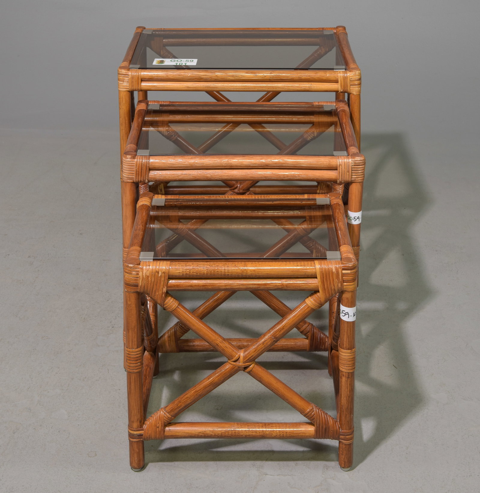 Faux Bamboo Nest of Three Tables with Glass: Faux Bamboo Nest of Three Tables with Smoke Glass - 22 in tall x 22.25 x 16.5, 18.75 in tall x 19.5 x 14.25 and 16 in tall x 16 x 12