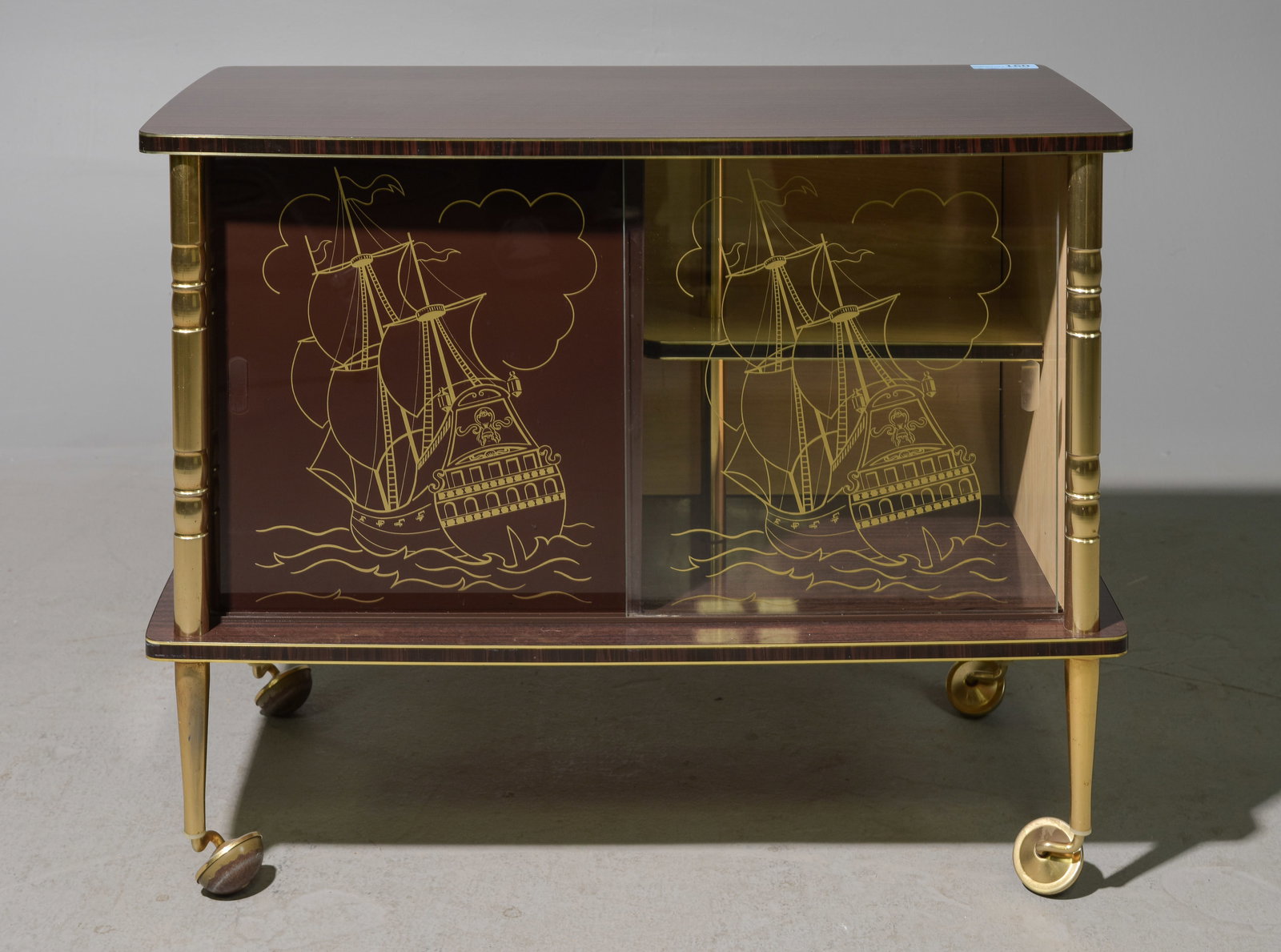 French Modern Laminate Bar Cart with Ship Design: French Modern Laminate Bar Cart / Cabinet with Sliding Glass Doors and Ship Detail - 27.5 in tall x 34 x 16