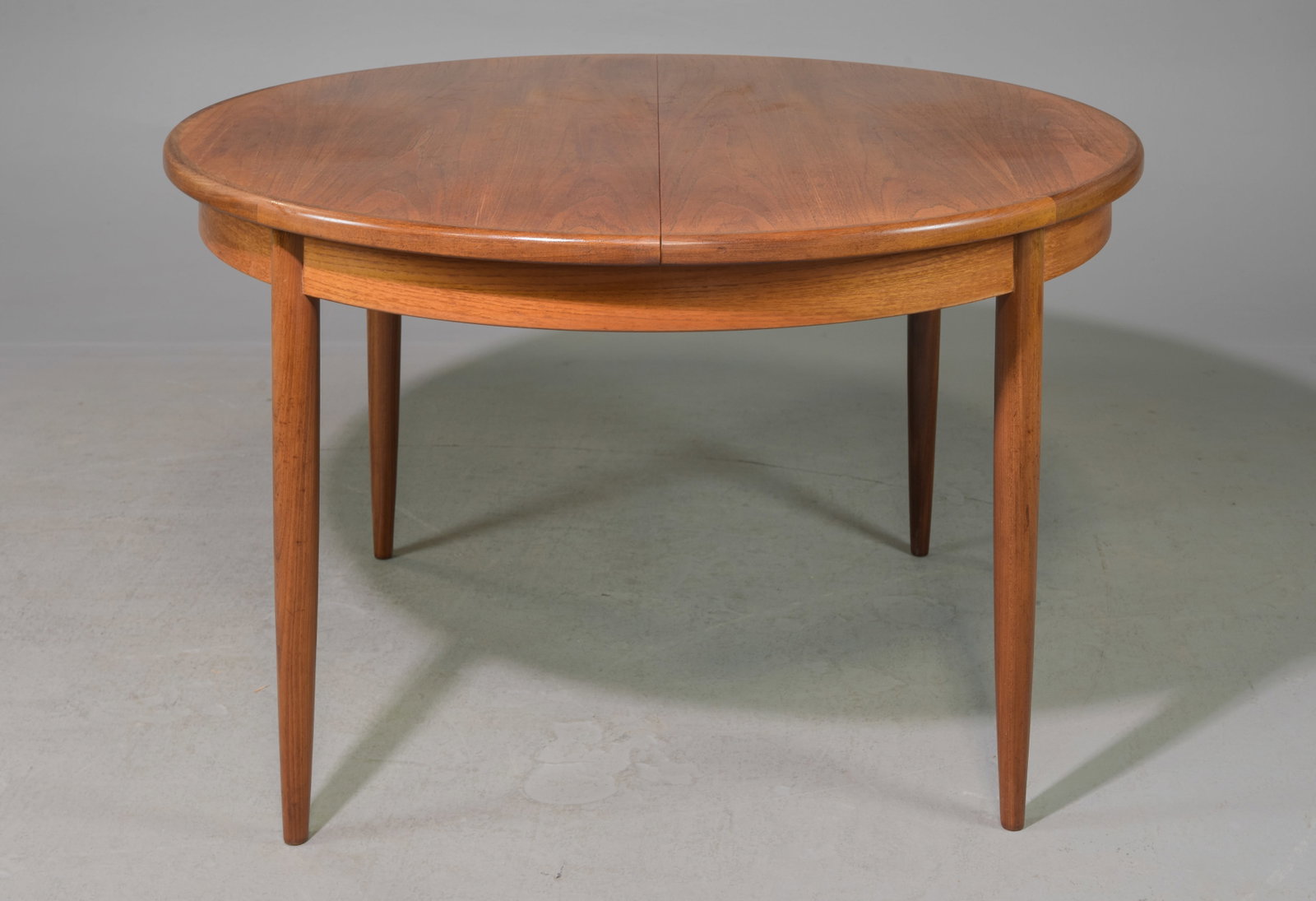 Round Mid Century Table By G-Plan - Pop Up Leaf: This Danish Modern Style Teak Dining Table includes a pop-out butterfly style leaf & is made by Mid Century Modern Furniture Maker G Plan ( GPlan ) - Part of their Fresco Range. - 29 in tall x 48 inch