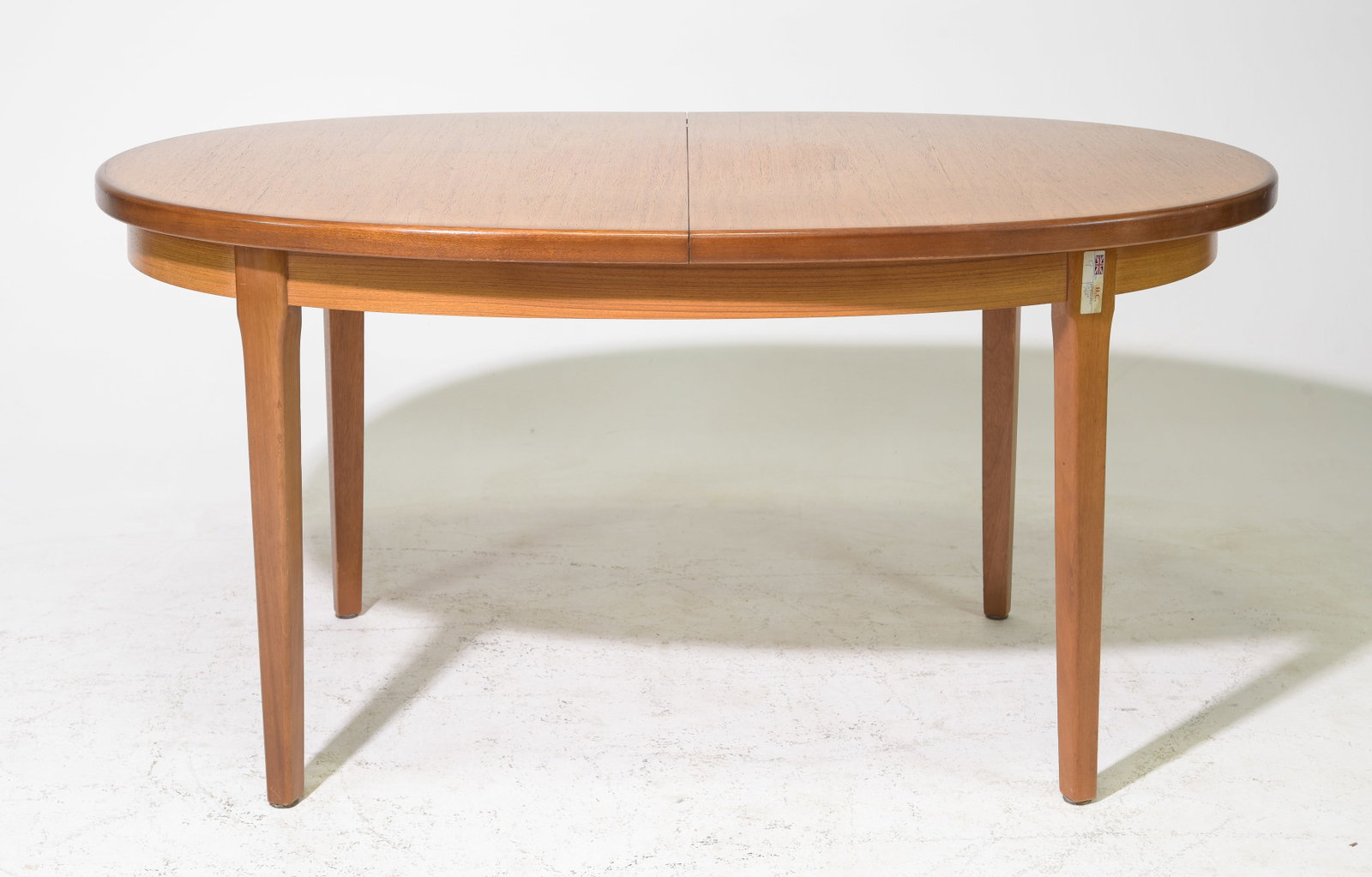 Oval Mid Century Teak Dining Table By G-Plan: This Danish Modern Style Teak Dining Table includes a pop-out butterfly style leaf & is made by Mid Century Modern Furniture Maker G Plan ( GPlan ), part of their fresco range . - 29 in tall x 65 x 42