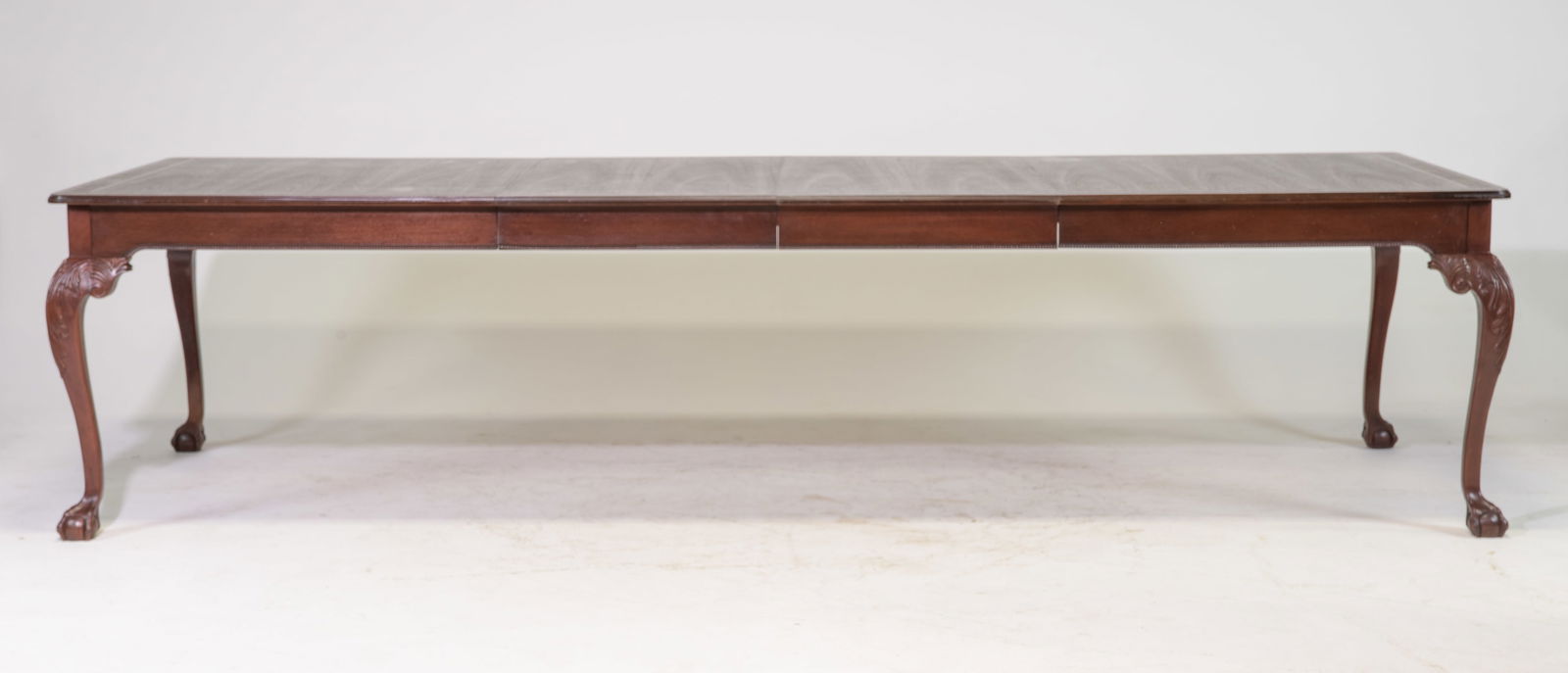 American Mahogany Ball & Claw Table with 2 Leaves: American Mahogany Ball & Claw Inlaid Dining Table with 2 Insertable Leaves - 30 in tall x 77(6.4 feet) x 46, Leaves add an additional 24 inches each, Floor to apron is 25 inches, Space between the leg