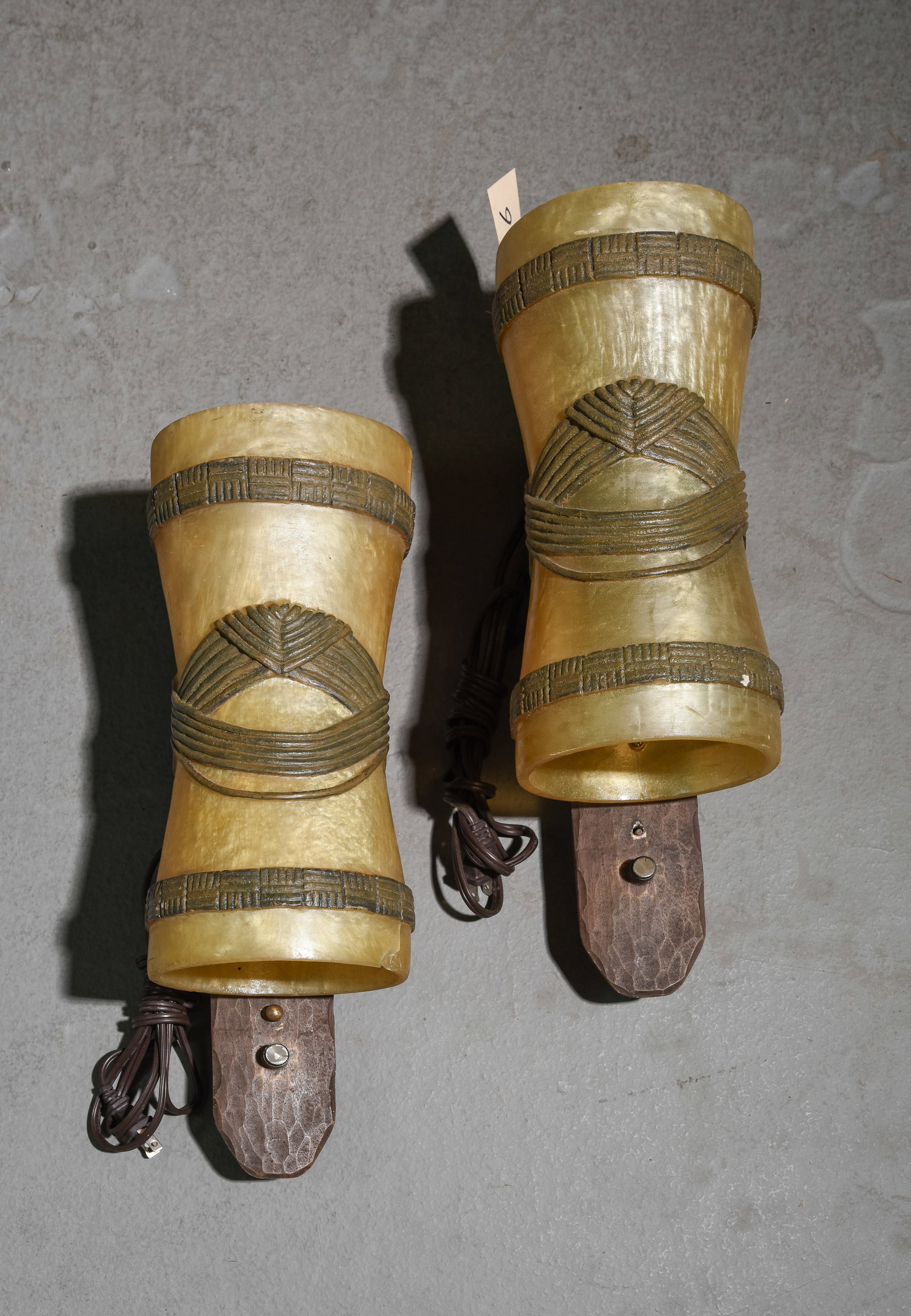 Two Tiki Sconces from the Disney Polynesian Resort: Two Tiki Sconces from the Disney Polynesian Resort 16 in tall x 7 x 7Find out more about the Disney Polynesian Village here: https://mytiki.life/tiki-bars/disneys-polynesian-village-resort