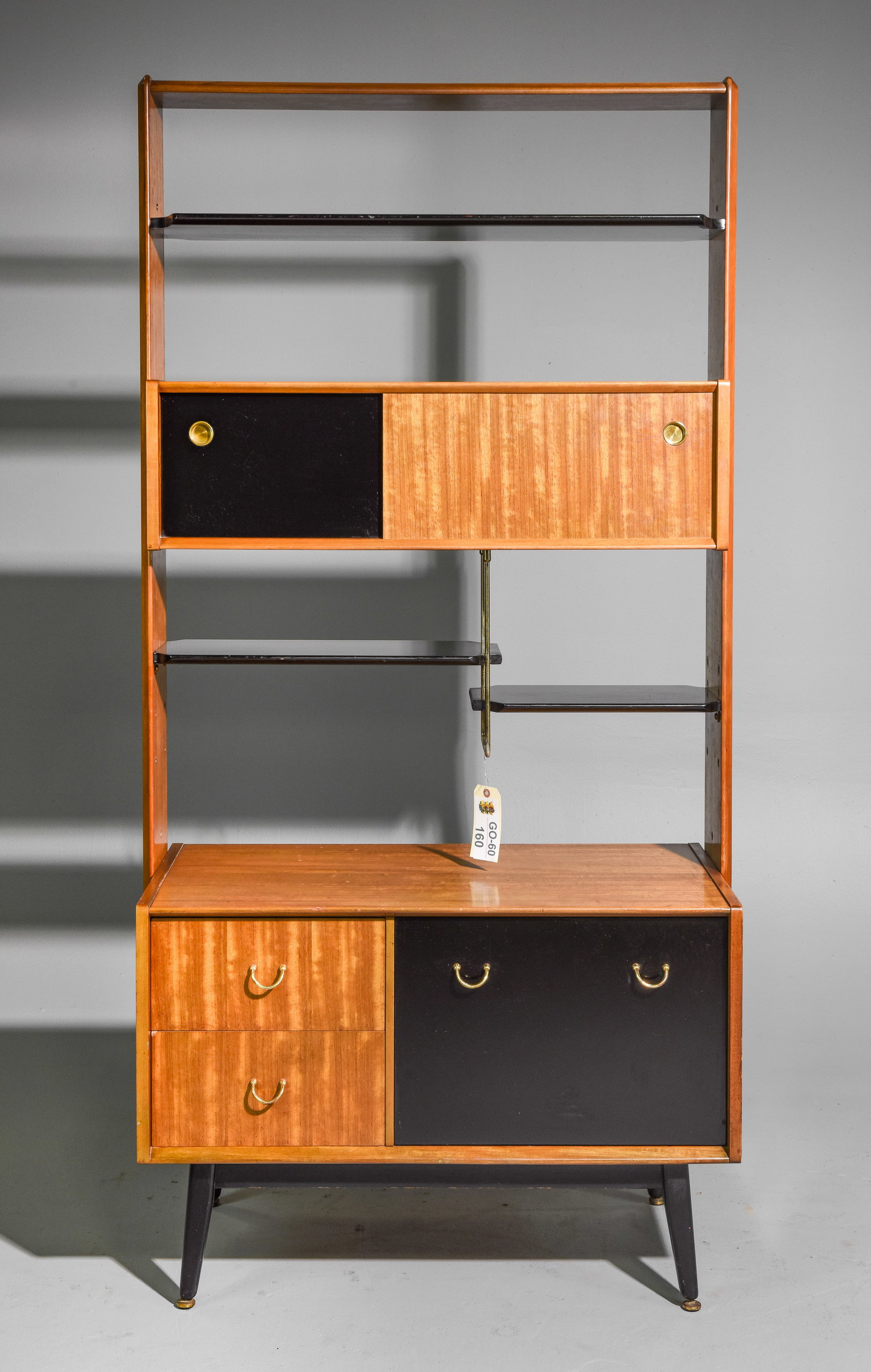 Mid Century Room Divider / Bookcase - Gplan Librenza: Danish Modern Style Bookcase / Wall Unit. This is the Librenza Model By Gplan, in their Black & Tola Finish. It is fully Finished on the back this piece can "Float" in a room. - 75.25 in tall x 37.75 