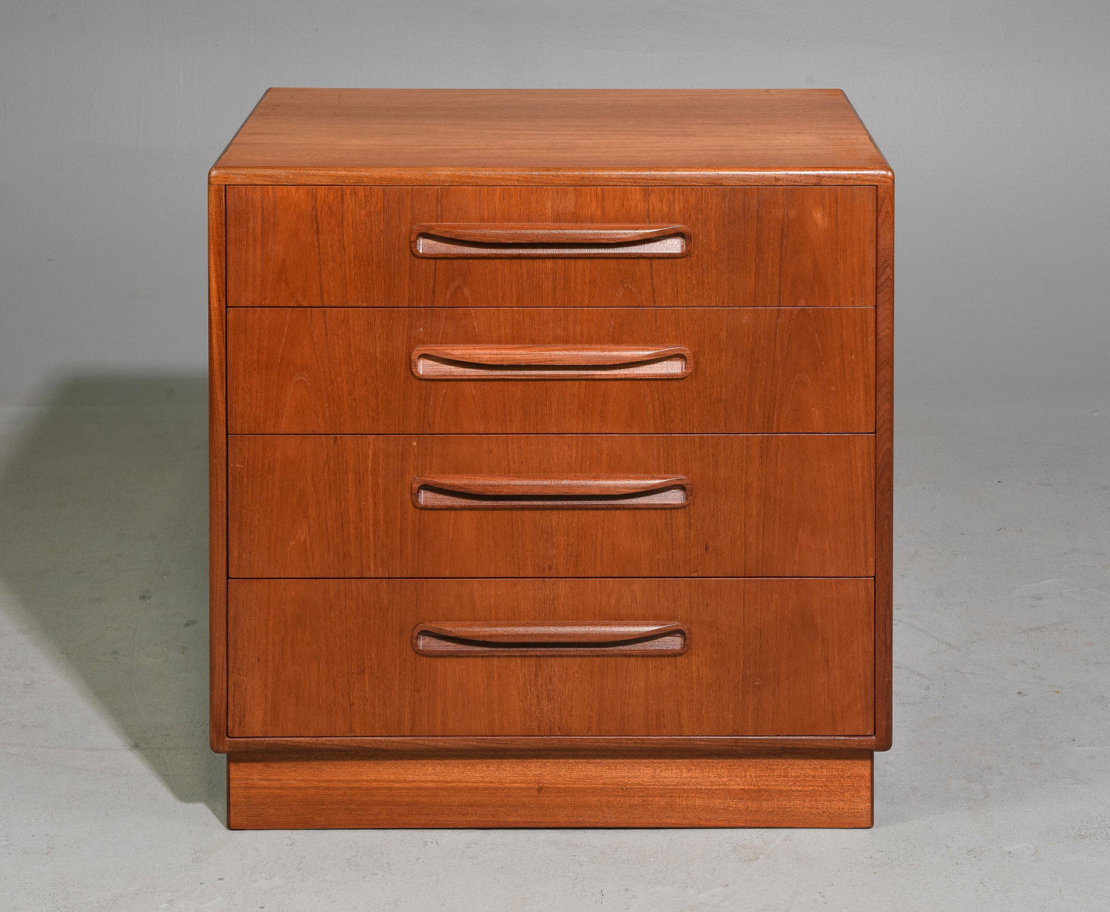 Mid Century Modern 4 Drawer Chest - Gplan: This Danish Modern Style Teak Four Drawer Teak Chest is by British Furniture Maker G-Plan - 30 in tall x 28.5 x 18