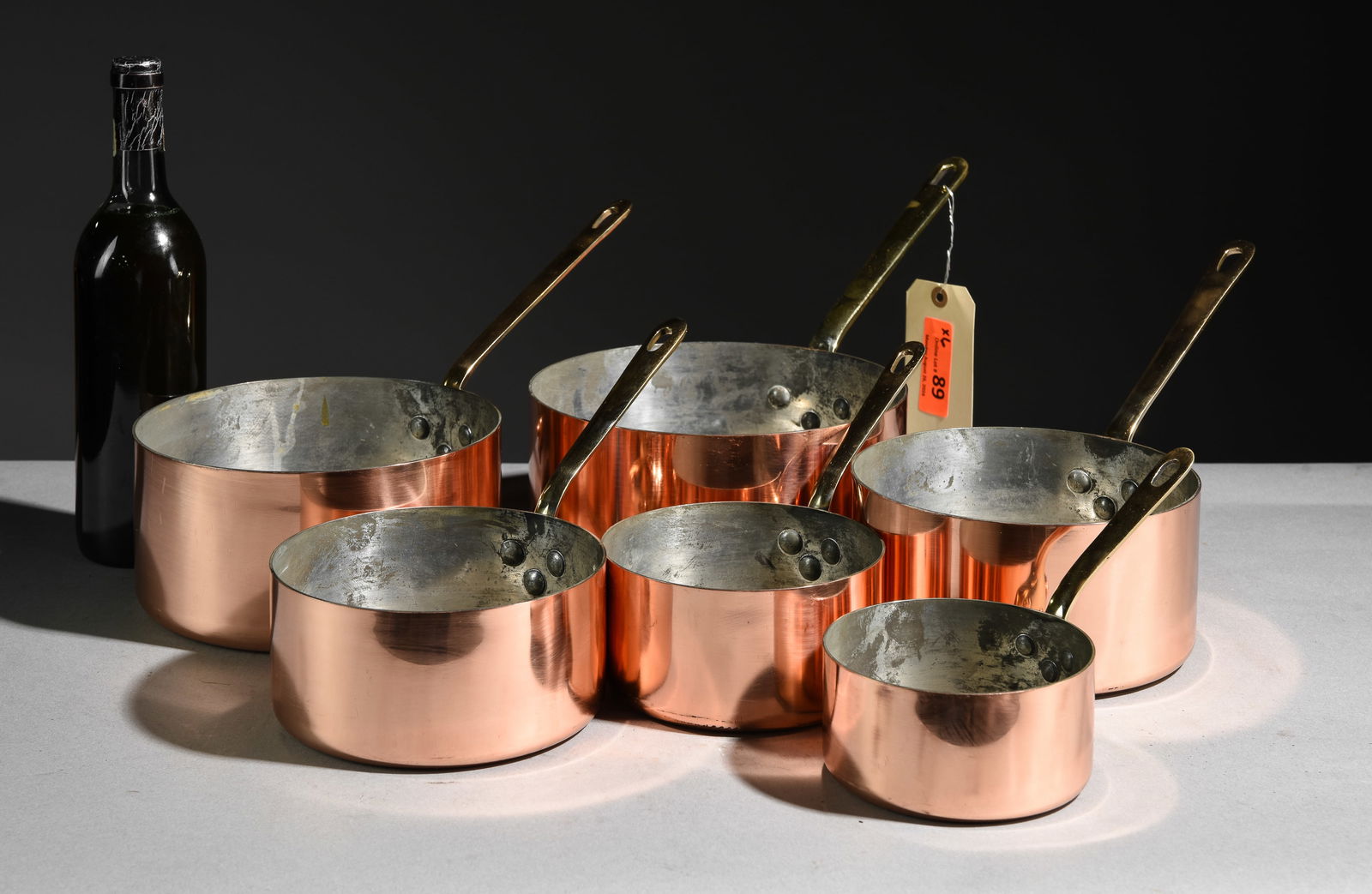 Set of 6 French Polished Copper Sauce Pans: Set of 6 French Polished Copper Sauce Pans with Brass Handles - Largest is 8 in tall x 17 x 9 - These are marked