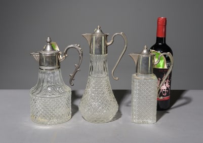 Three Assorted Cut Glass Claret Jugs