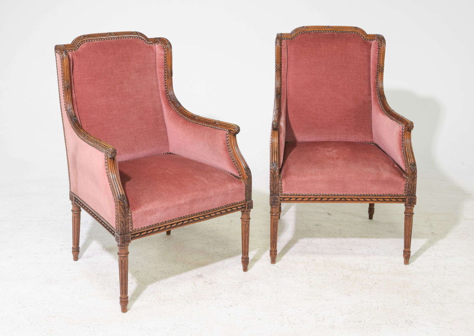 Louis XVI Style Pair of Beech Wood Arm Chairs: French Louis XVI Style Pair of Beech Wood Bergere Arm Chairs with Nail Head Detailing & Fluted Legs c.1930's-40's - 36 in tall x 23 x 24 each with a seat height of 16 inches, Seat depth is 18.75 inche