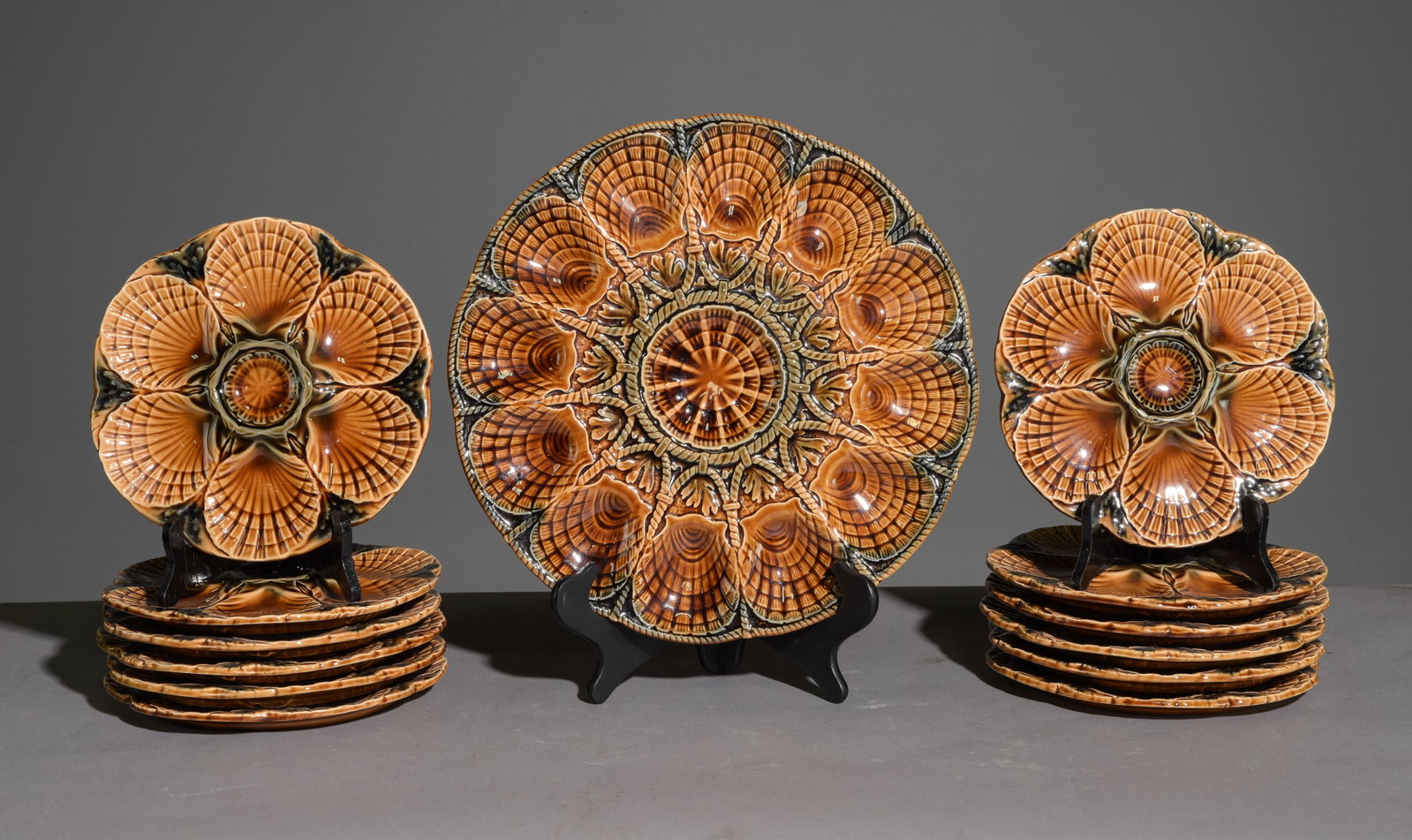 13pc French Majolica Scallop Plate Set: 13pc French Majolica Scallop Plate Set - Platter & 12 Plates - 1.25 in tall x 14.75 inch diameter and the plates are 1 in tall x 9.5 inch diameter each