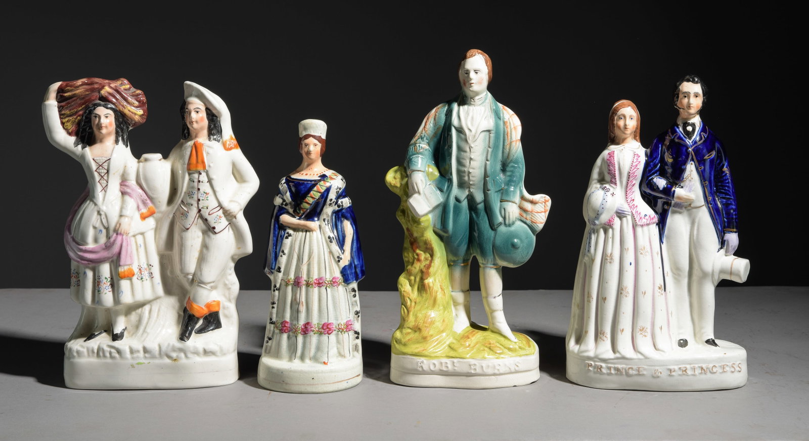 Four Staffordshire Figures - Man & Woman: Four Staffordshire Figures - Man & Woman - 13.5 inches tall x 7 x 3.5