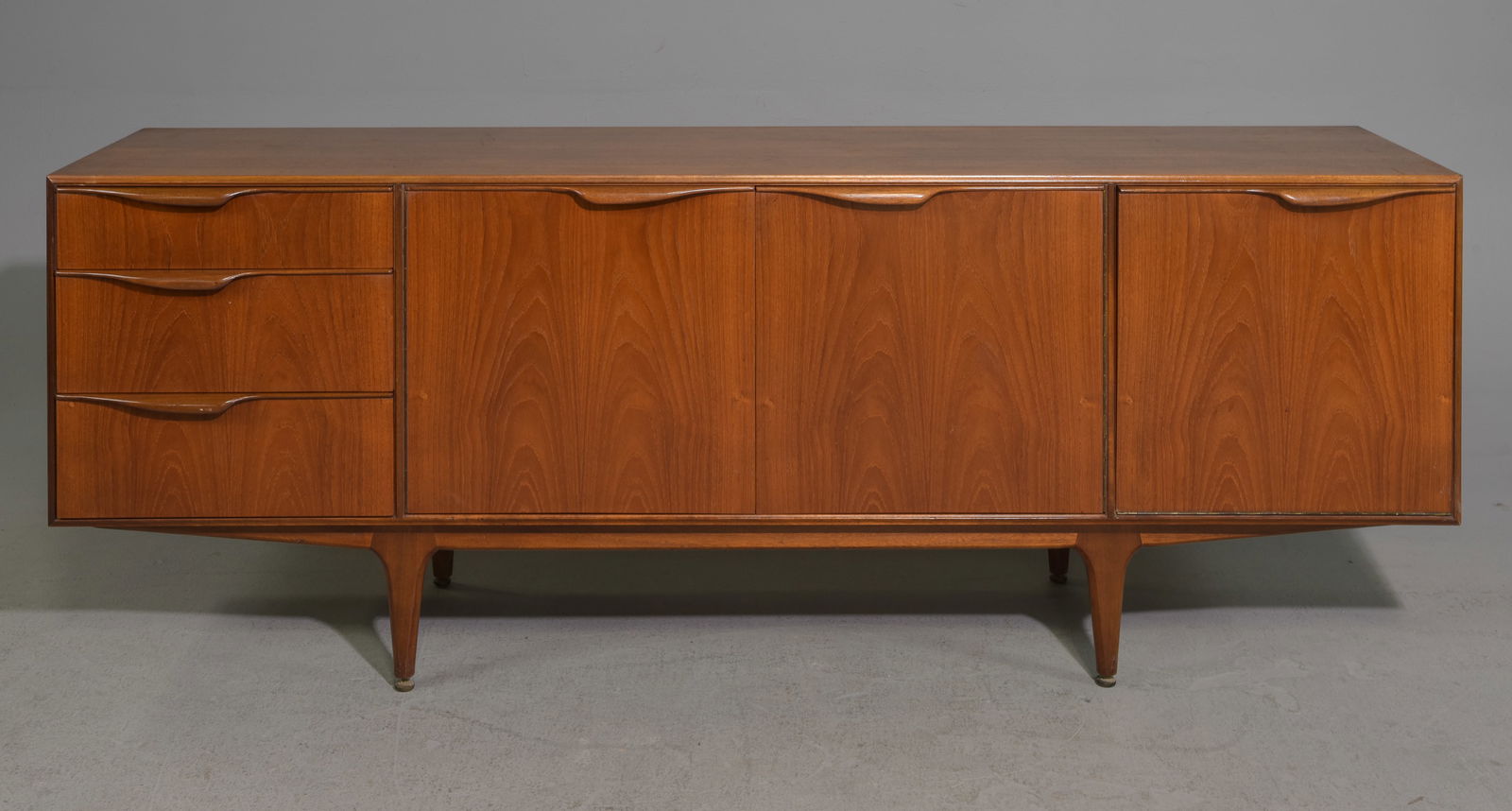 Mid Century Sideboard - Mcintosh - "Dunvegan": This Danish Modern Style Teak Credenza / Cocktail Sideboard with folded handles & pull out tray is made by Scottish Mid Century Modern Furniture Maker McIntosh. It was designed by Tom Robertson, it is