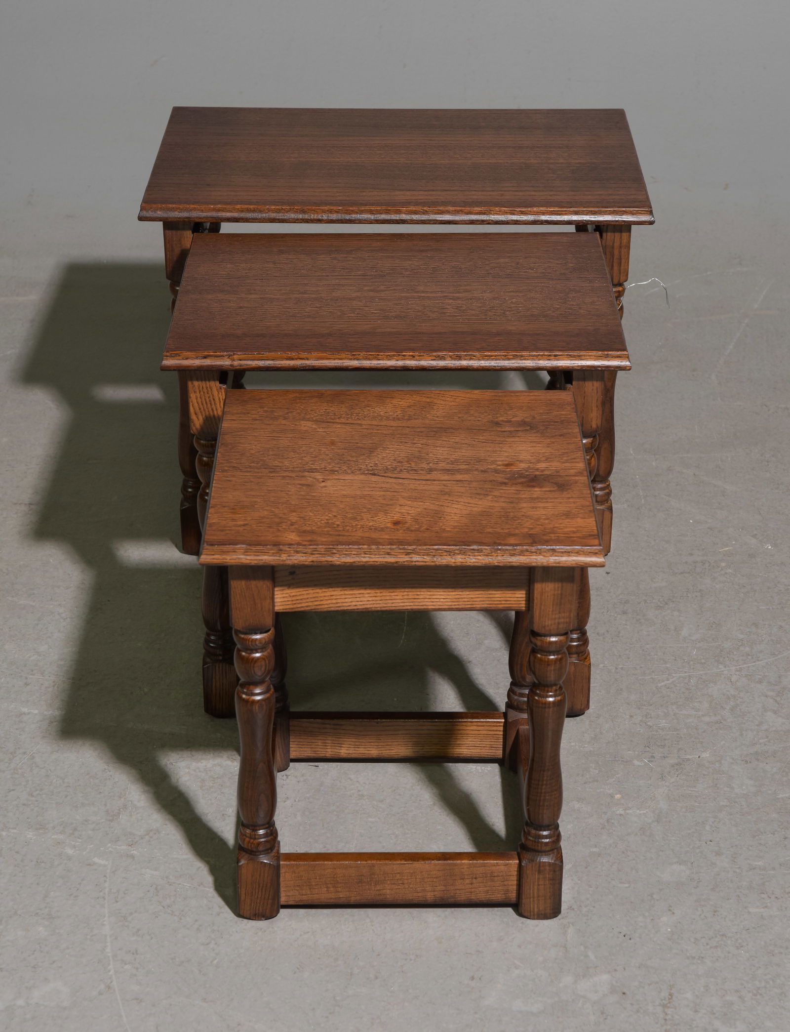 Oak Nest of 3 Tables with Turned Legs #1: Oak Nest of 3 Tables with Turned Legs - Tallest is 16 in tall x 19.5 x 13, middle one is 15 in tall x 15.5 x 12, smallest one is 14 in tall x 11.5 x 11