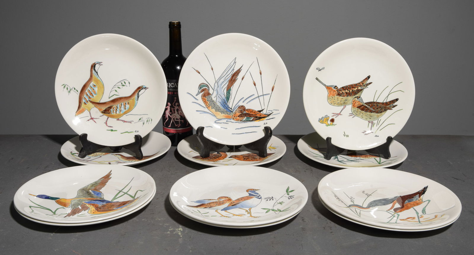French Set of 12 Gien Faience Hand Painted Plates: French Set of 12 Gien Faience Hand Painted Plates Depicting Birds with Artist Signature - 1 in tall x 10 inch diameter each