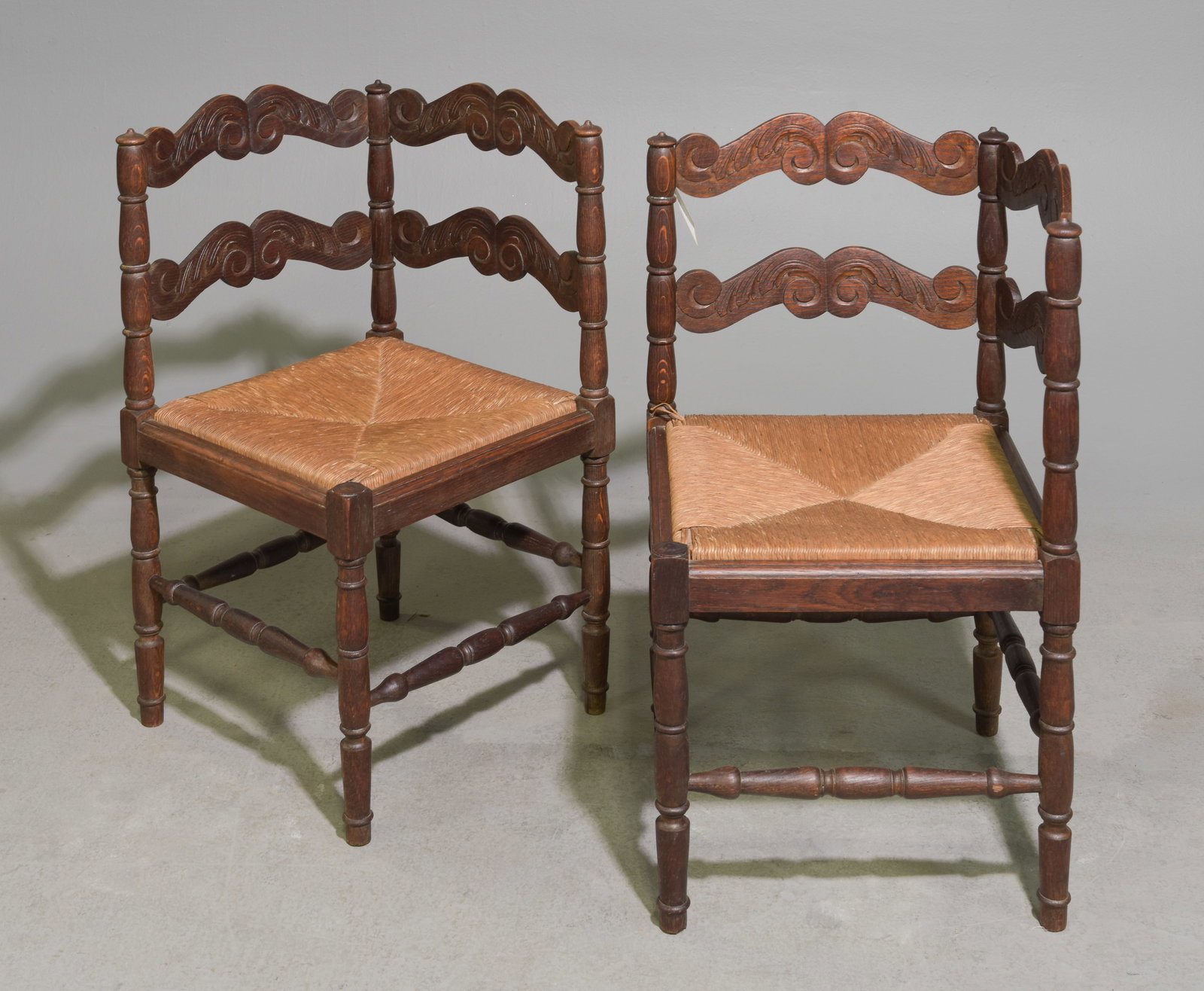 French Pair of Oak Rush Seat Corner Chairs: French Pair of Oak Rush Seat Corner Chairs - 29 in tall x 23.5 x 23 with a seat height of 18 inches