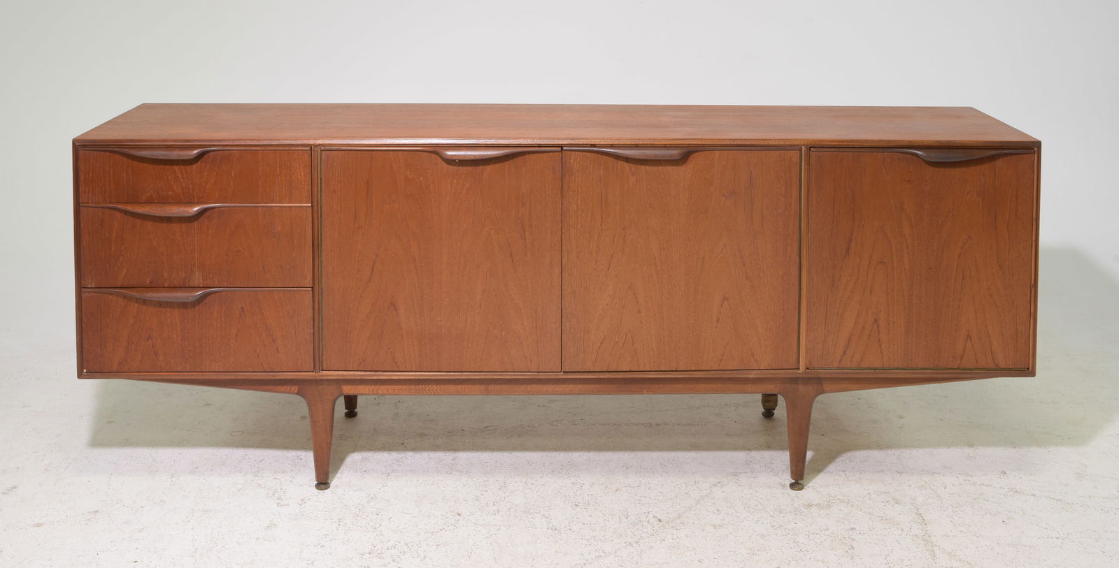 Mid Century Sideboard - Mcintosh - "Dunvegan": This Danish Modern Style Teak Credenza / Cocktail Sideboard with folded handles & pull out tray is made by Scottish Mid Century Modern Furniture Maker McIntosh. It was designed by Tom Robertson, it is