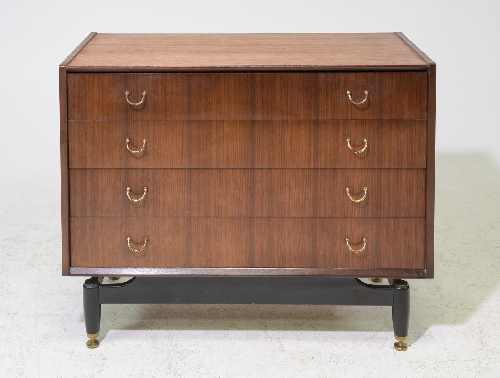 G-Plan Black and Tola Mid Century Modern Chest #1: This Danish Modern Style tall chest is made in England by G Plan, it is made from tola wood and features 4 drawer with brass hardware and a black base with adjustable feet. Gplan is well known in the 
