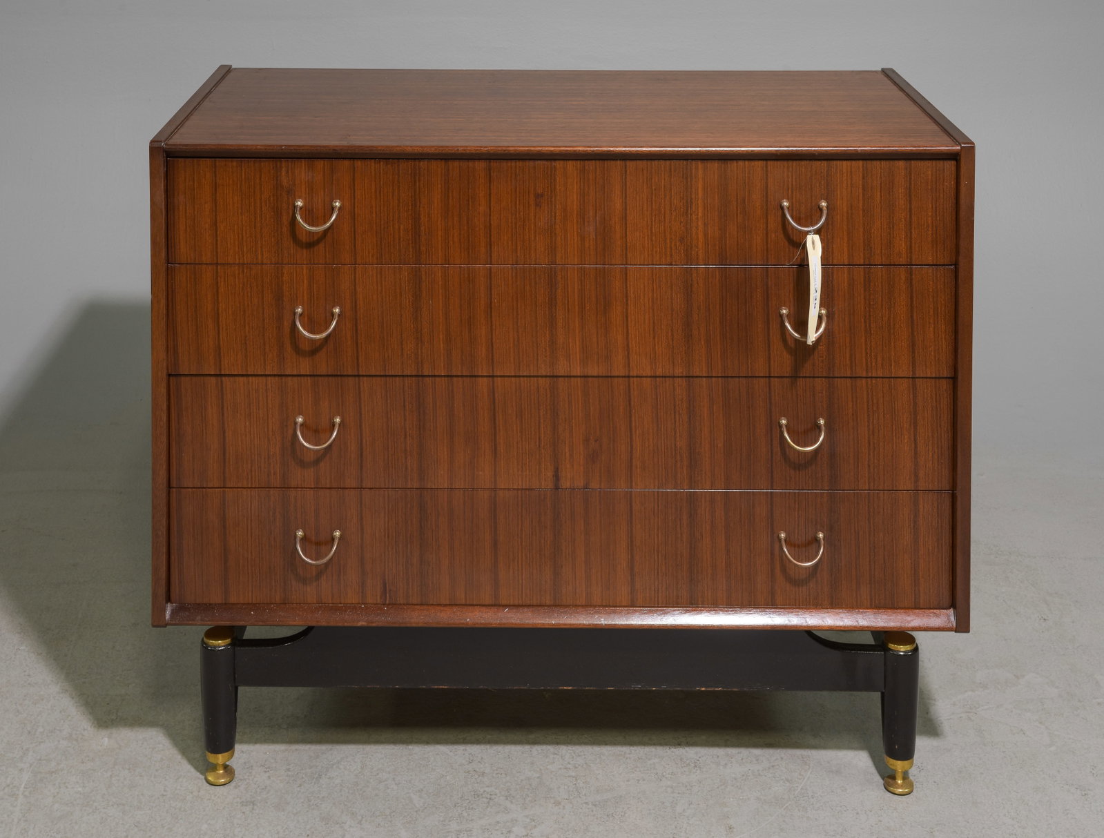 G-Plan Black and Tola Mid Century Modern Chest #2: This Danish Modern Style tall chest is made in England by G Plan, it is made from tola wood and features 4 drawer with brass hardware and a black base with adjustable feet. Gplan is well known in the 