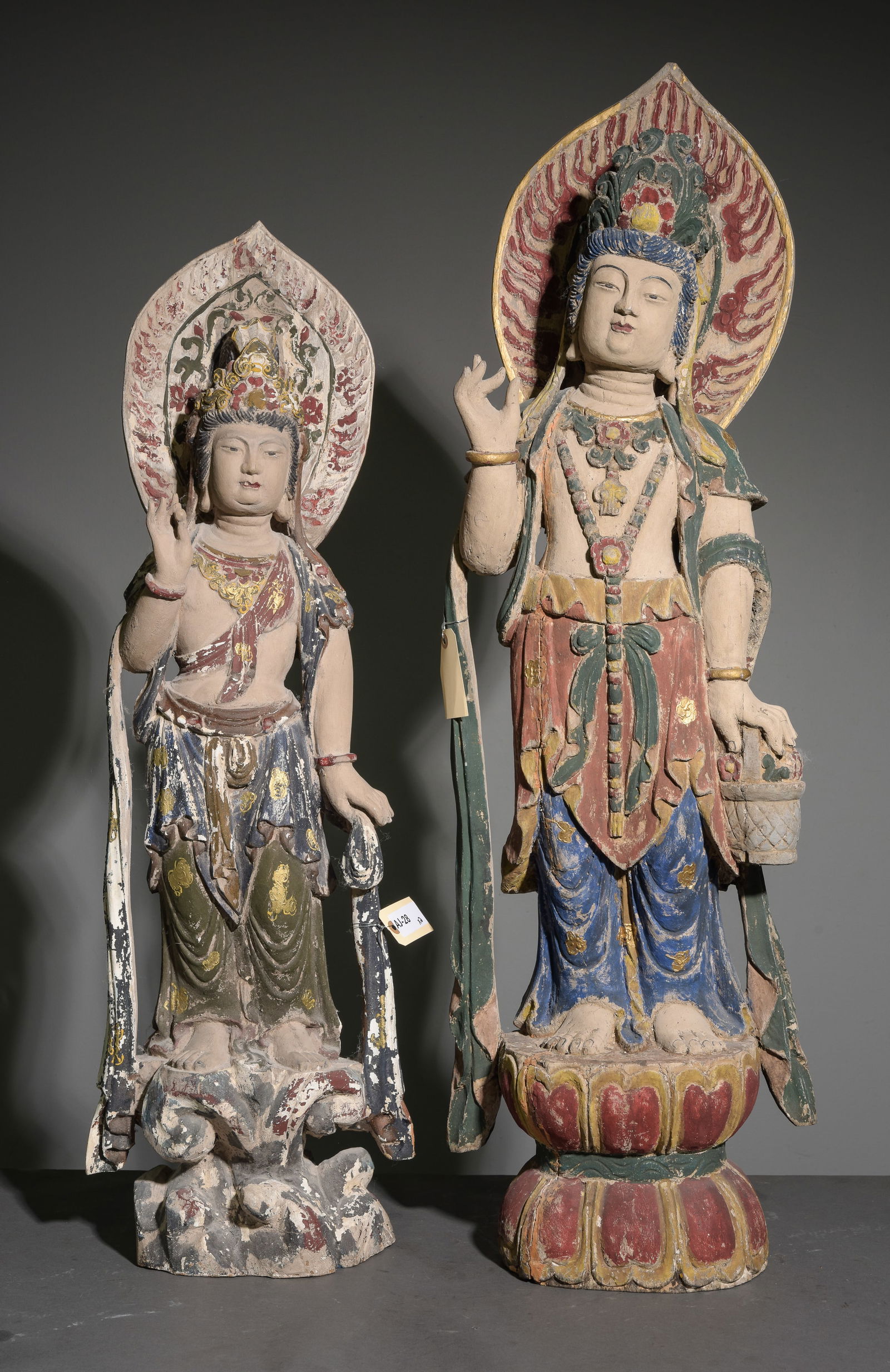 Two Hand Carved Polychrome Guanyin Statues: Two Hand Carved Polychrome Guanyin Statues - 38 in tall x 12 x 6 and 43 in tall x 14 x 7 - These figures are of Bodhisattva associated with compassion in East Asian Buddhism.
