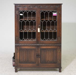 English Oak Leaded Glass Bookcase: English Oak Leaded Glass Bookcase with Linen Fold Paneling - 54 in tall x 37.5 x 13