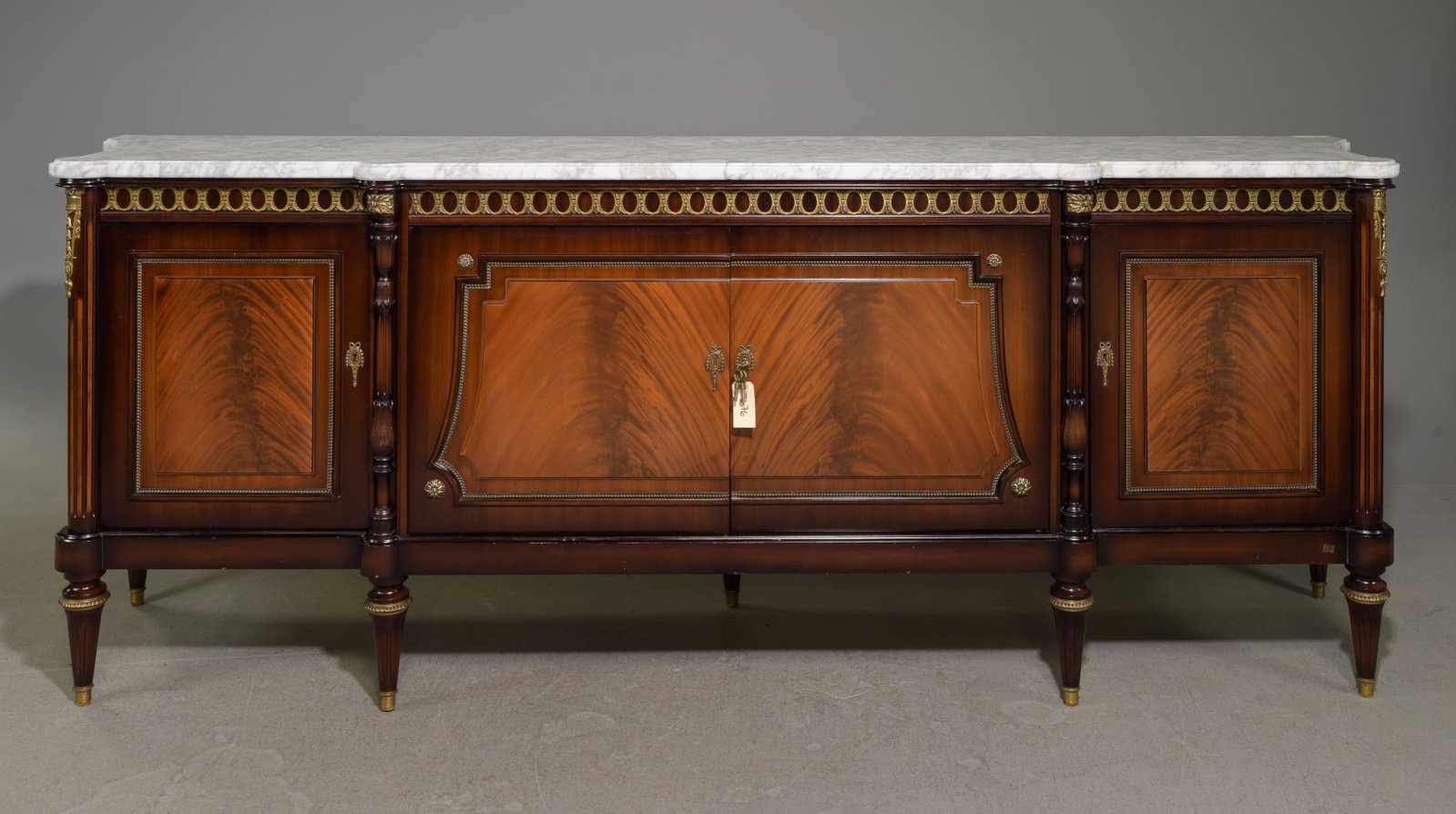 Louis XVI Style White Marble Top Sideboard: French Louis XVI Style White Marble Top Mahogany Sideboard / Enfilade with Gilded Ormolu Adornments and Shaped Sides - 39 in tall x 102.5 x 23.5 - This is 8.5 feet long