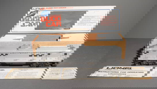 Lionel Illuminated Budd Car - O and O27 Gauge: Lionel Illuminated Budd Baggage Car Dummy - O and O27 Gauge - This lot is in the original box model number 6-8765. - Box measures 4 in tall x 18 x 6  Illuminated cars show passengers silhouetted in wi