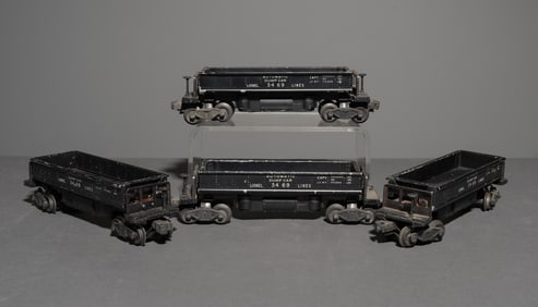 Four Lionel Lines 3469 Automatic Dump Cars