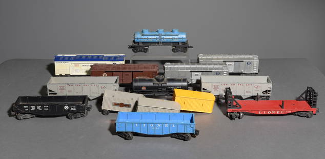 14pcs Lionel Box Cars, Hoppers, Tankers, Etc.: 14pcs Lionel Box Cars, Hoppers, Tankers, Etc. - This lot consists of a Lionel 6477 Freight Car, a Lionel Lines 6025 Chemical Tanker Car, an Automatic Merchandise 3454 Car, an Automobiles Pennsylvania