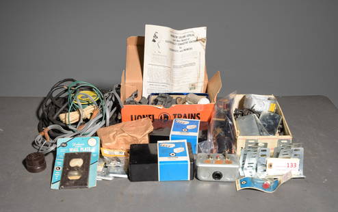 Assorted Track and Train  Components #1: This lot contains items related to Lionel trains and tracks to include vintage die-cast cowcatchers and an assortment of electrical components, wiring, control housing and semiconductors as well as ot