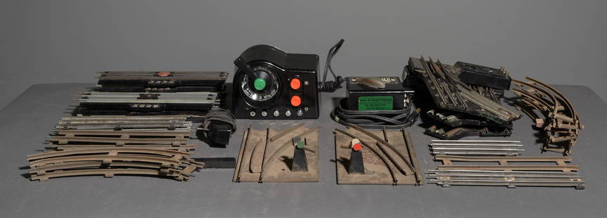 21pcs - Lionel and Marx Track Components: This lot consists (1) Lionel Trainmaster Type LW 125 Watt transformer, (1) Automatic Switch Controller, (3) Lionel No. 022 Remote Control switches, (7) Lionel UCS Remote Control Track Section, (5) 3-R