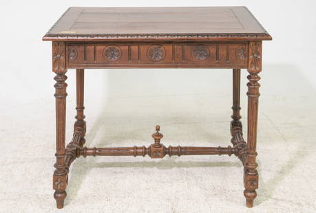 French Breton Style Carved Oak Writing Table: French Breton Style Carved Oak Writing Table - 29.5 in tall x 35 x 23, Floor to under is 23.5 inches and the space between the legs is 28.5 inches