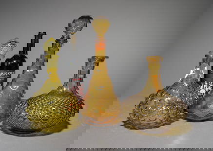 3 Italian Empoli Style Glass Decanters: 3 Italian Empoli Style Glass Decanters - This lot consists of an Empoli Style Green Bubble Glass Decanter, an Empoli Style Amber Glass Dimpled Genie Bottle Decanter and an Empoli Style Diamond Cut Dec