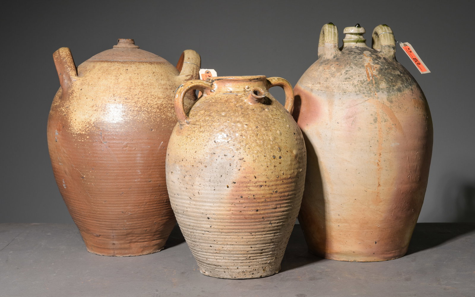 Three French Terracotta Wine Jugs: Three French Terracotta Wine Jugs - 19.5 in tall x 12 inch diameter, 17 in tall x 13 inch diameter and 15 in tall x 11 inch diameter