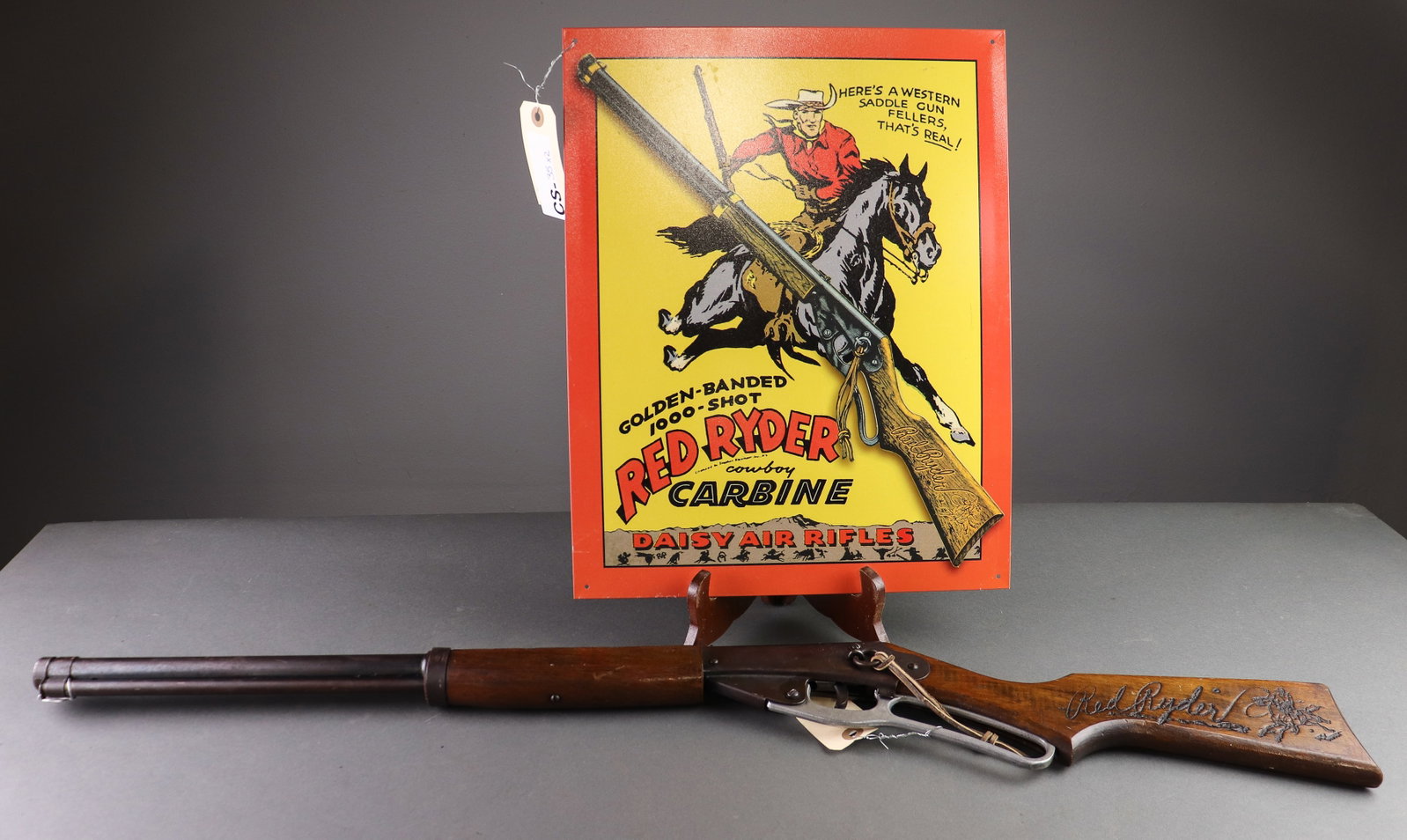 Red Ryder BB Gun & Sign C. 1940's: Red Ryder BB Gun & Sign C. 1940's - 36 in tall x 6.5 x 2