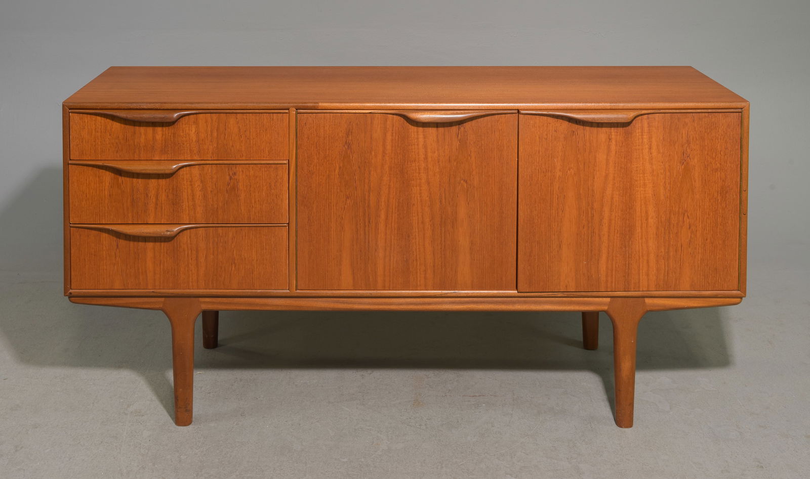 Mid Century Sideboard by McIntosh - "Dunvegan / Moy" #2: This Danish Modern Style Teak Credenza / Cocktail Sideboard with folded handles is made by Scottish Mid Century Modern Furniture Maker McIntosh. It was designed by Tom Robertson, it is the Short "Dunv