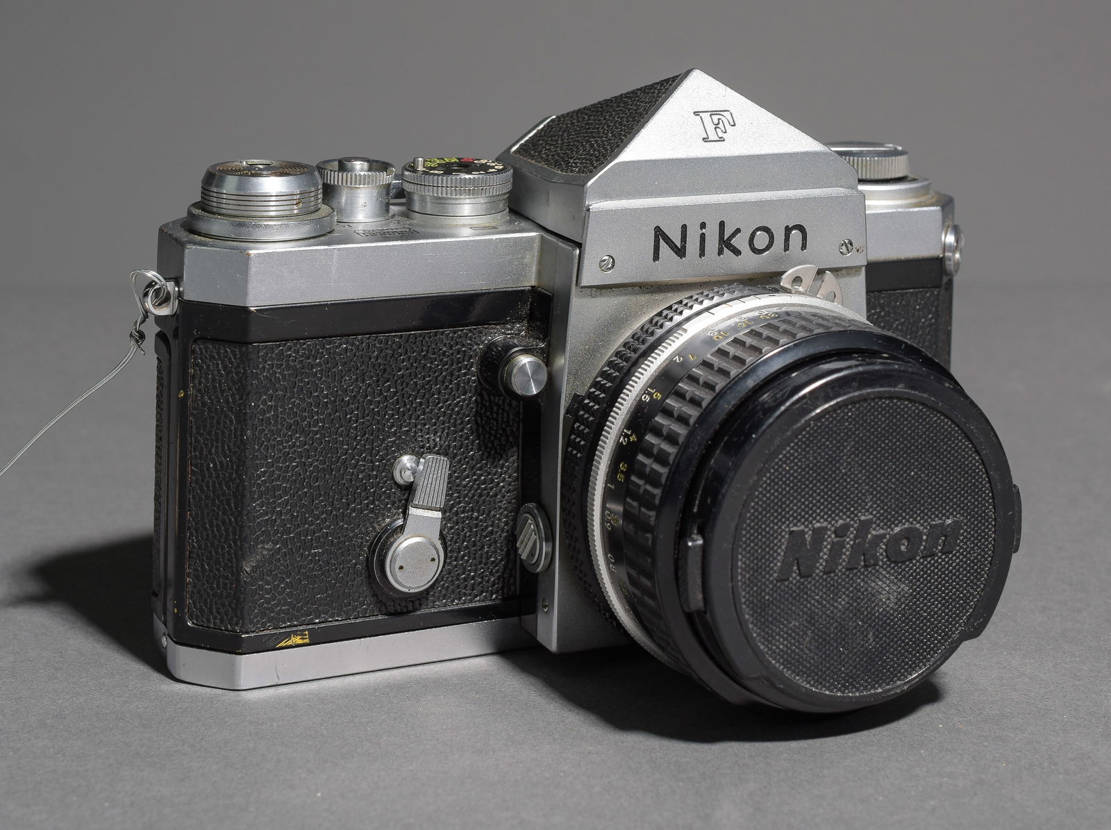 Nikon F film camera body with Nikkor 50mm 1:1.8 Lens (1840854): Item: Nikon F film camera body with Nikkor 50mm 1:1.8 Lens (1840854)Brand: NikonModel/Serial Number: 6488035