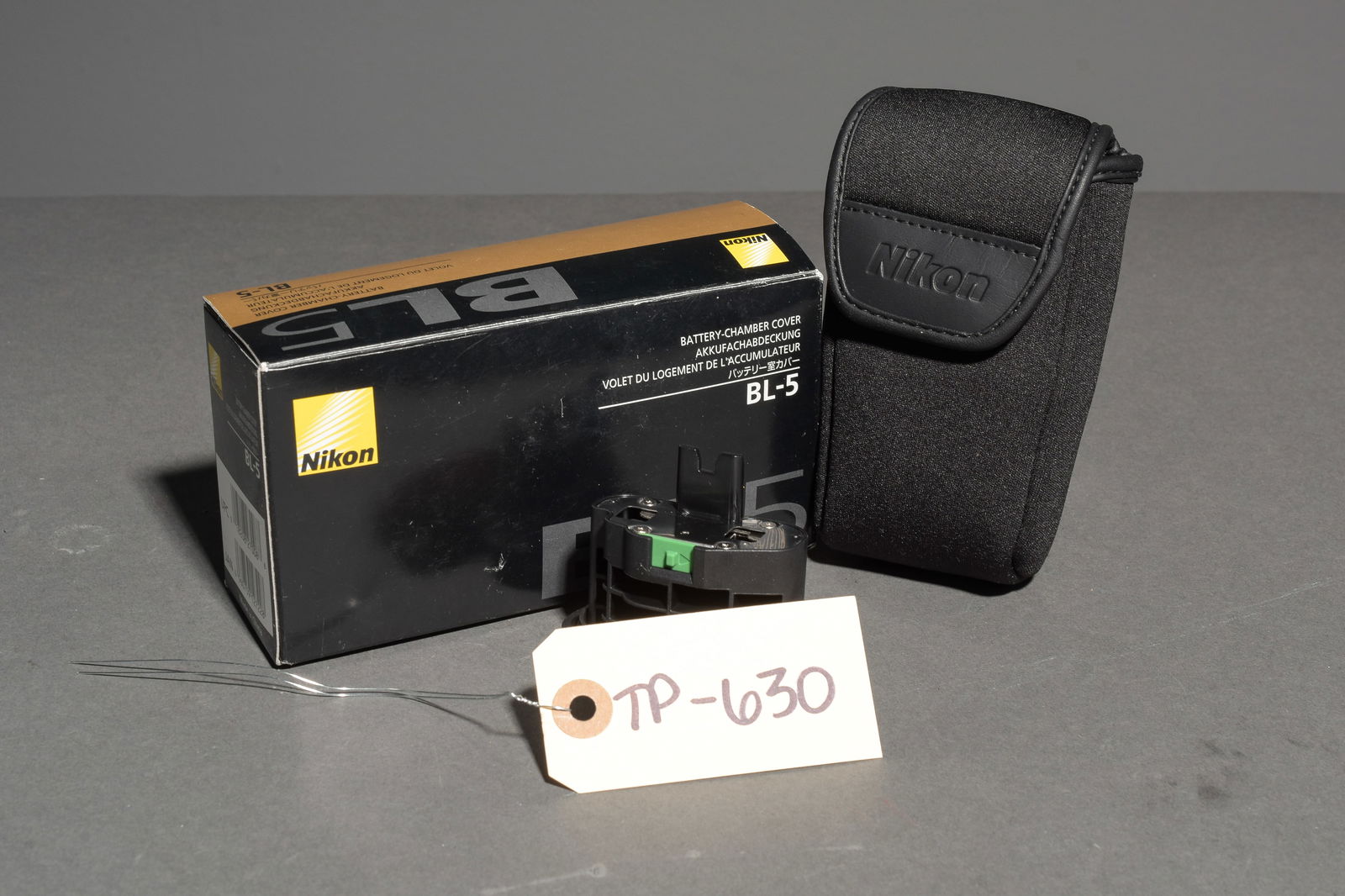 Nikon BL-5 Battery Chamber Cover: Item: Nikon BL-5 Battery Chamber CoverBrand: NikonModel/Serial Number: