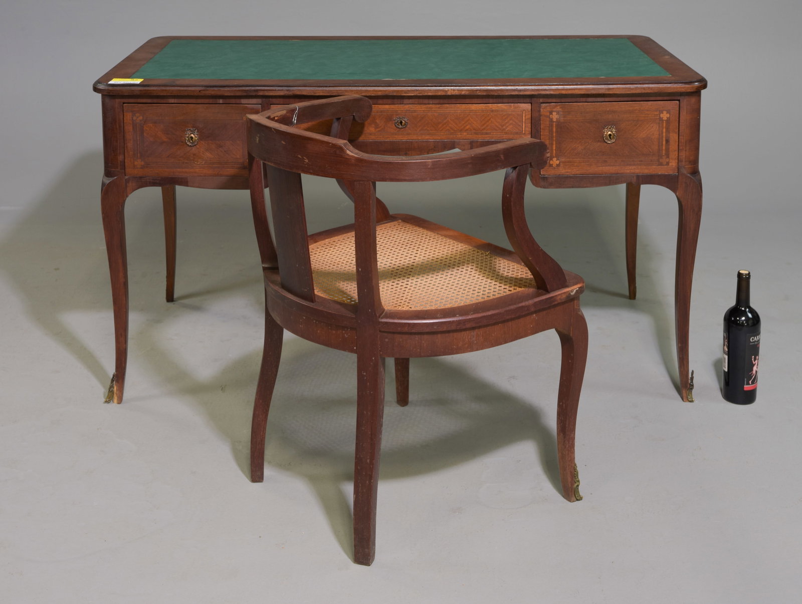 French Green Vinyl Top Desk with Cane Seat Arm Chair: French Green Vinyl Top Desk with Cane Seat Arm Chair - 29.5 in tall x 53.5 x 28, Kneehole is 23 x 22, Chair is 30 in tall x 21 x 22.5 with a seat height of 17.5 inches - Desk does have a pull out surf