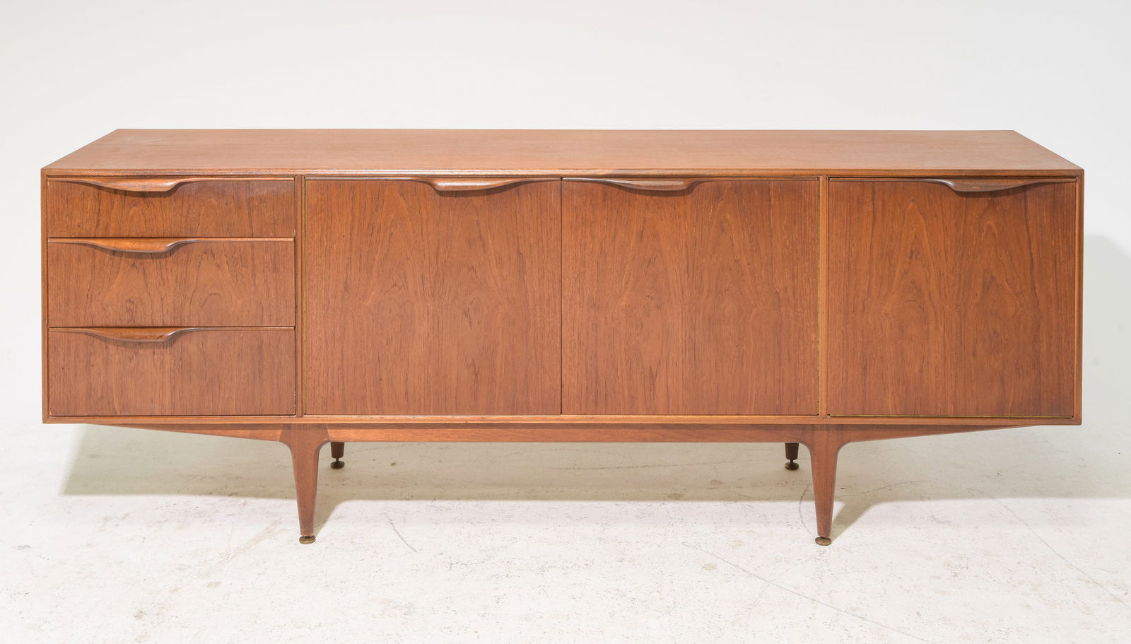 Mid Century Sideboard - Mcintosh - "Dunvegan": This Danish Modern Style Teak Credenza / Cocktail Sideboard with folded handles & pull out tray is made by Scottish Mid Century Modern Furniture Maker McIntosh. It was designed by Tom Robertson, it is
