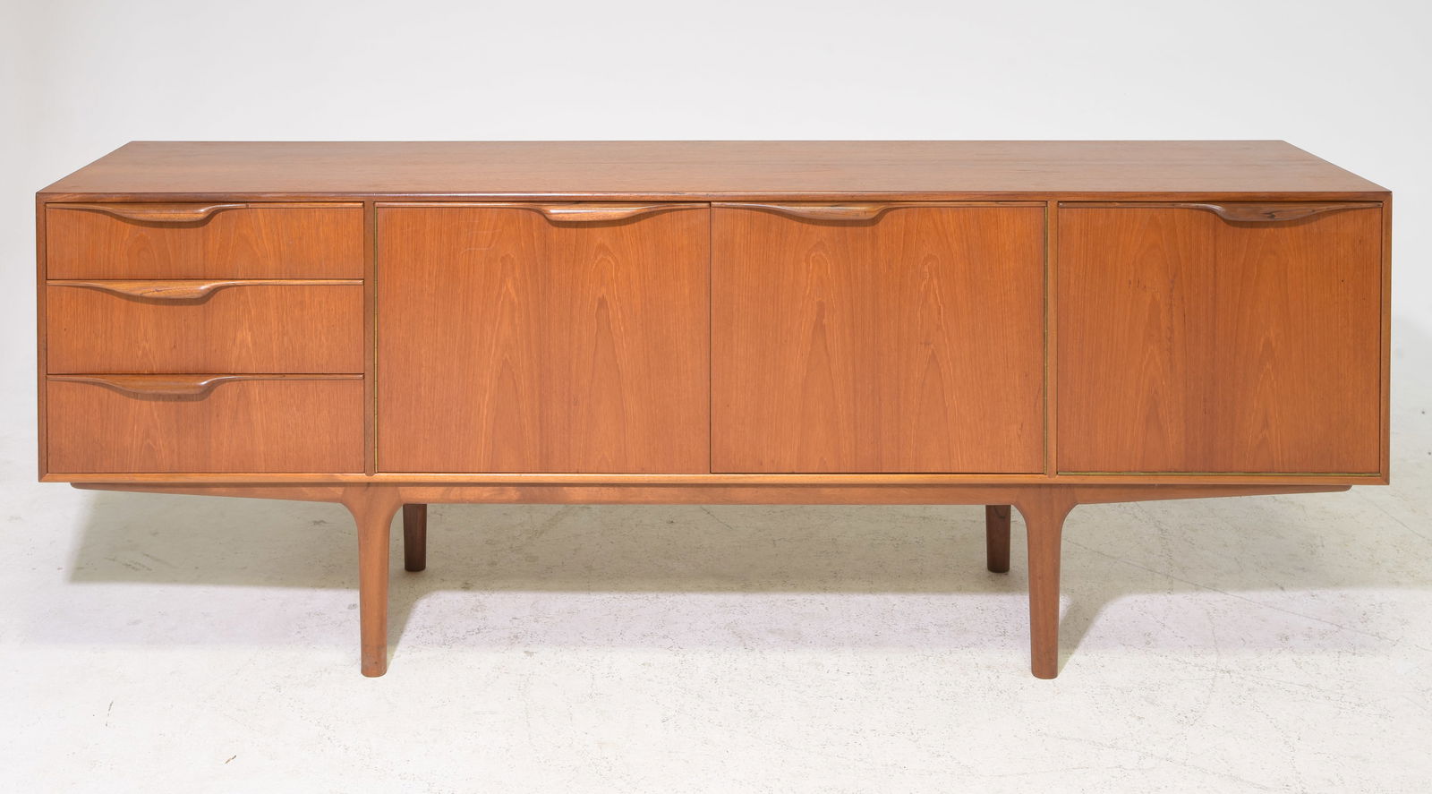 Mid Century Sideboard - Mcintosh - "Dunvegan": This Danish Modern Style Teak Credenza / Cocktail Sideboard with folded handles & pull out tray is made by Scottish Mid Century Modern Furniture Maker McIntosh. It was designed by Tom Robertson, it is