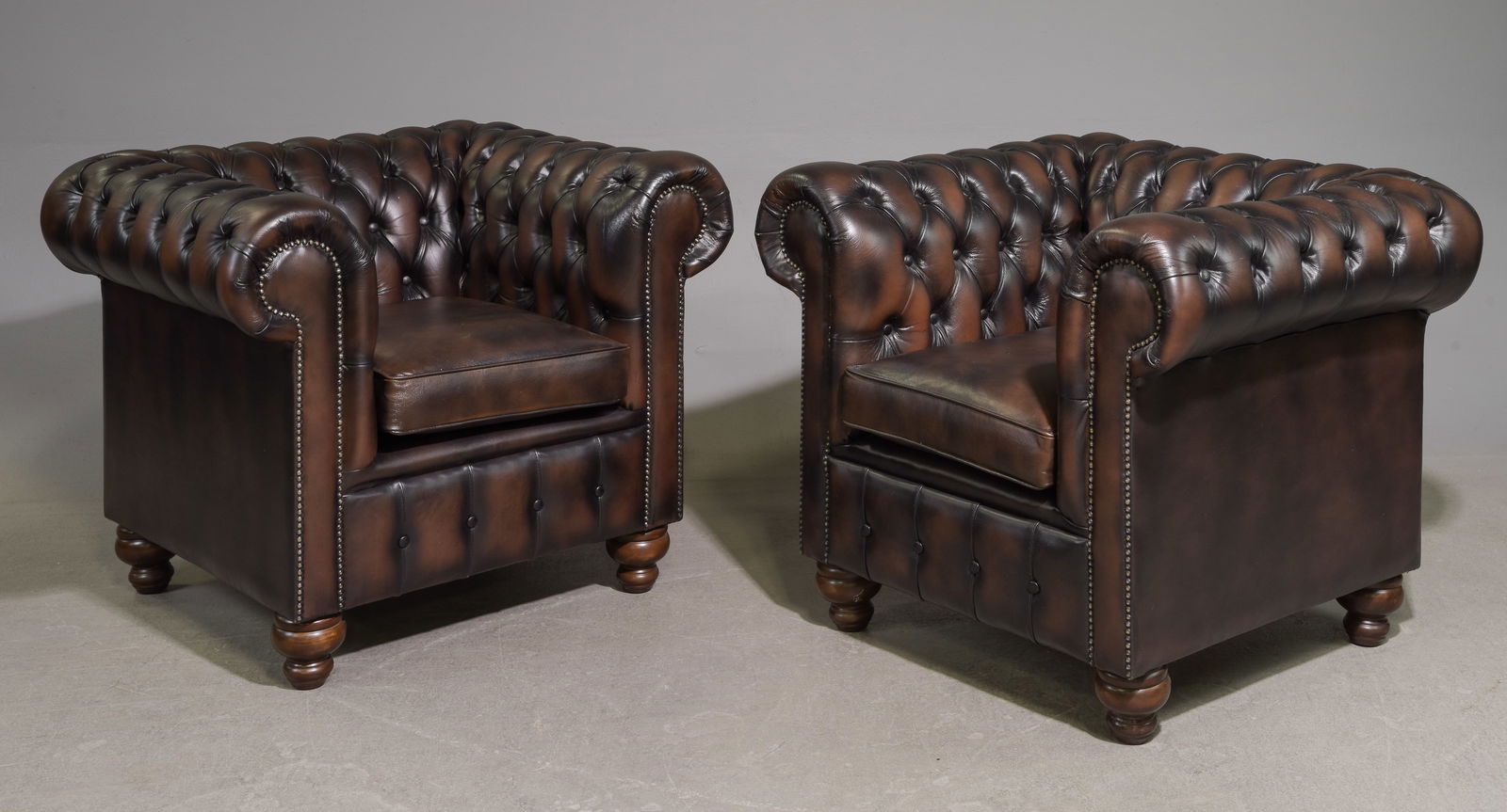 British Chesterfield Pair of Brown Leather Club Chairs: British Chesterfield Pair of Brown Leather Club Chairs - 31 in tall x 40 x 34 each with a seat height of 20 inches