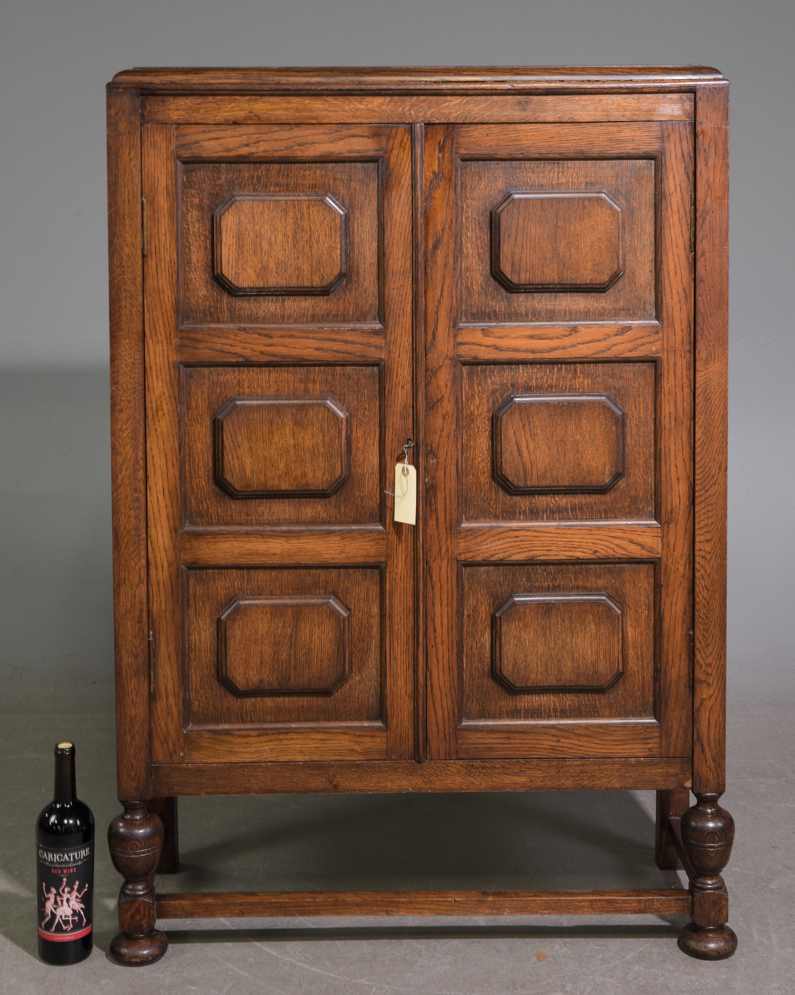 Jacobean Oak Two Door Cabinet with Paneled Doors: Jacobean Oak Two Door Cabinet with Paneled Doors c.1930's-40's - 49 in tall x 34.5 x 13.5