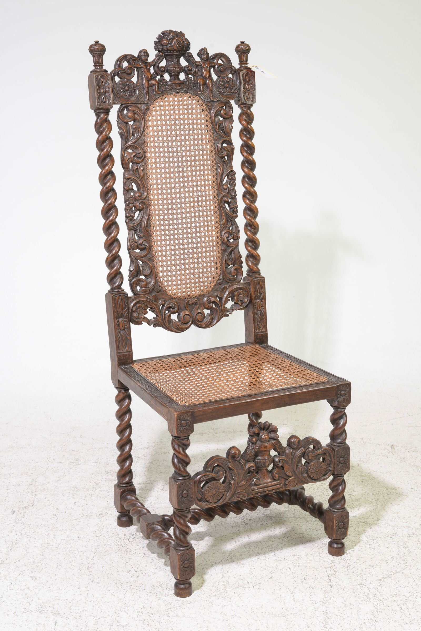 British Finely Carved Oak Caned Barley Twist Hall Chair: British Finely Carved Oak Caned Barley Twist Hall Chair - 48.5 in tall x 18 x 17 with a seat height of 17.5 inches