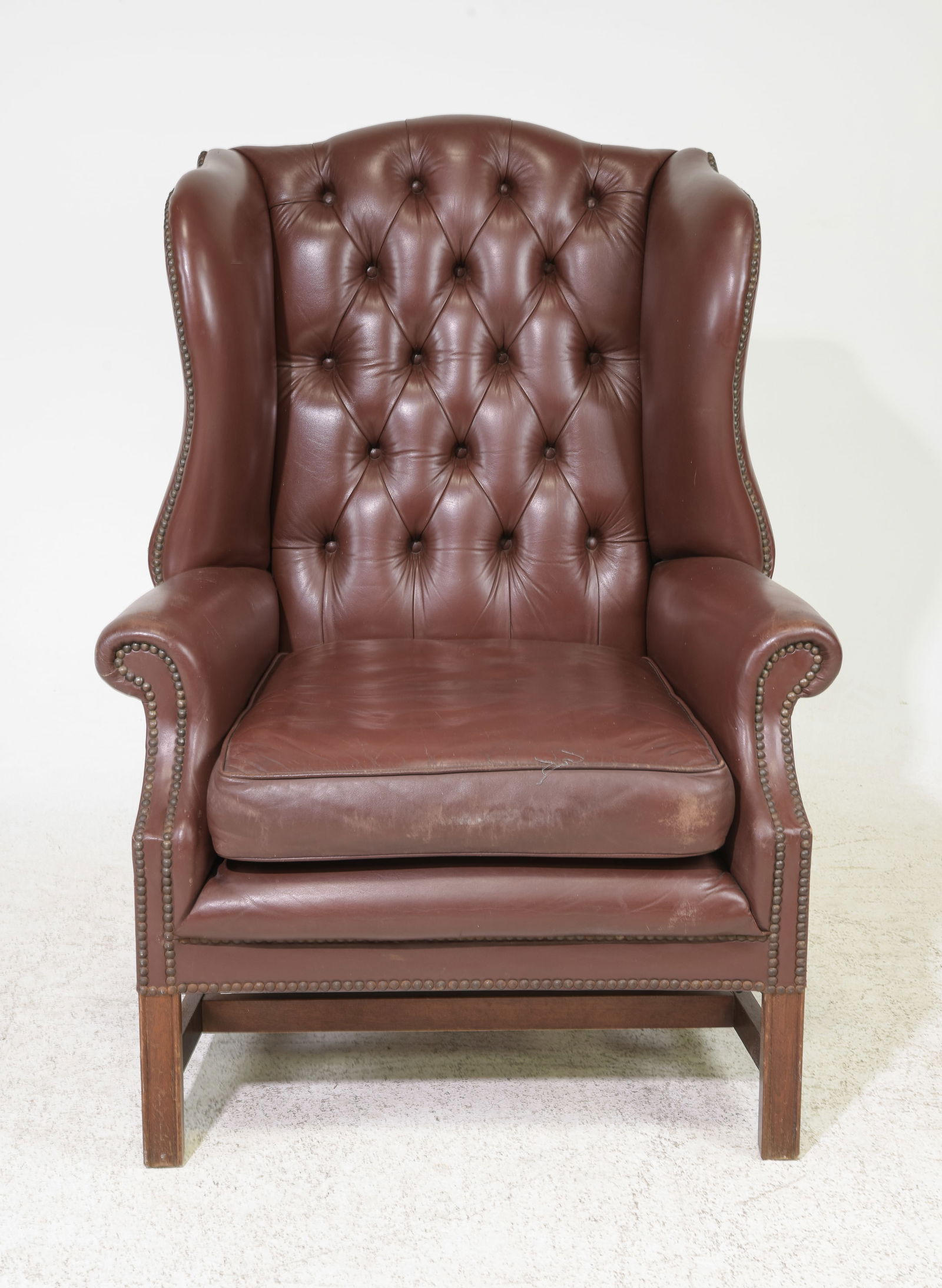 British Brown Leather Wing Back Arm Chair: British Brown Leather Wing Back Arm Chair - 43 in tall x 32 x 31 with a seat height of 19 inches