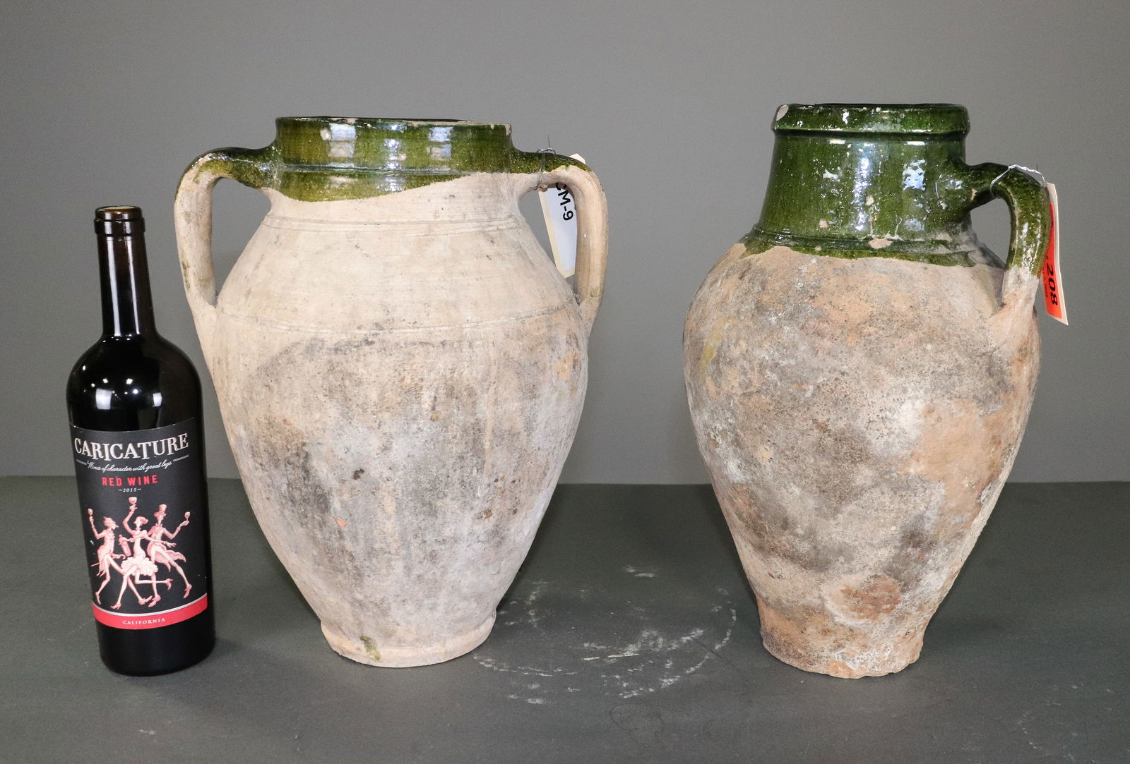 Two Green Glazed Olive Jars: Two Green Glazed Olive Jars - 14 in tall x 11 x 10, 14.5 in tall x 9 x 9