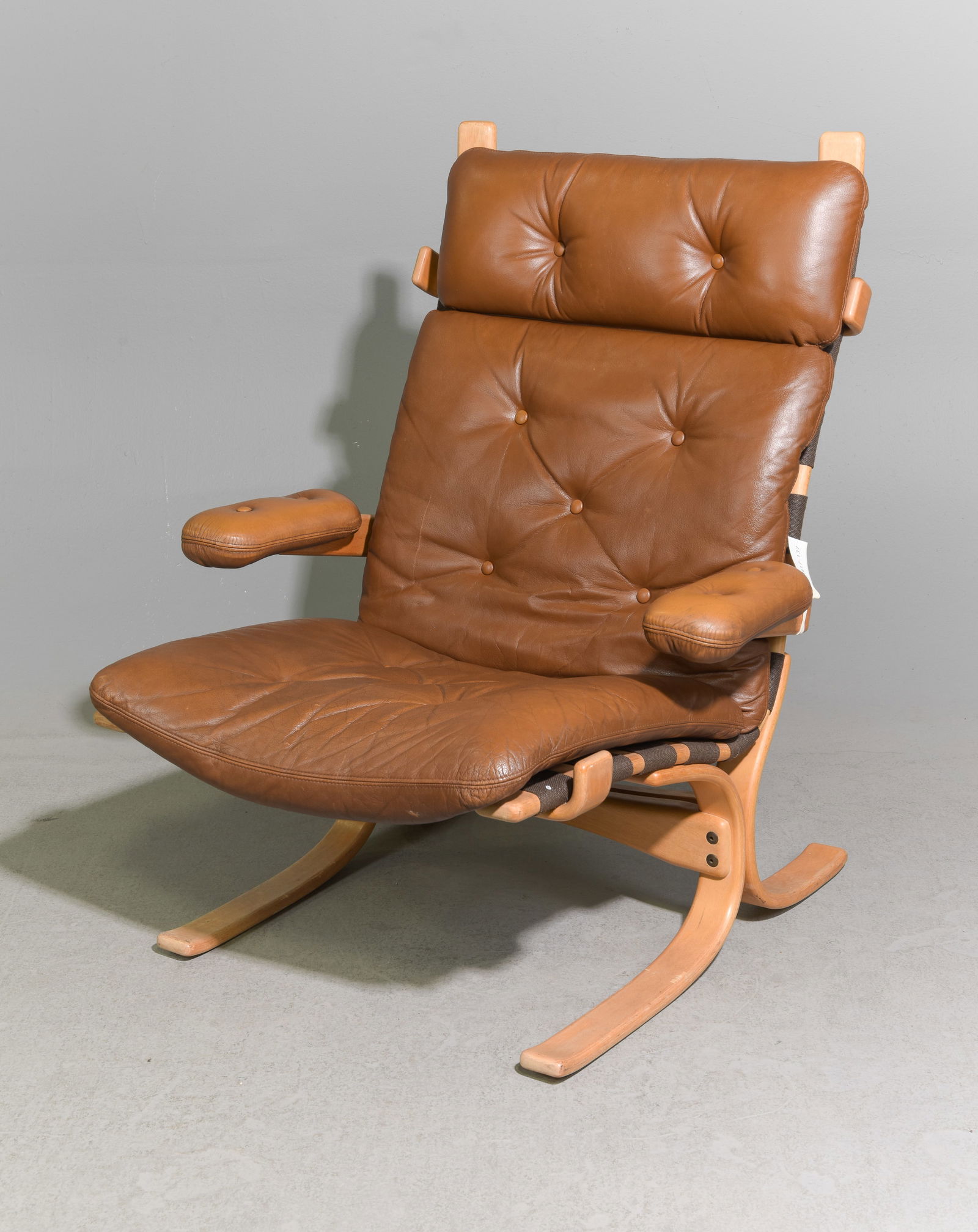 Danish Modern Brown Leather Arm Chair: Danish Modern Brown Leather Lounge Chair - 38 in tall x 31.5 x 34 with a seat height of 15.5 inches